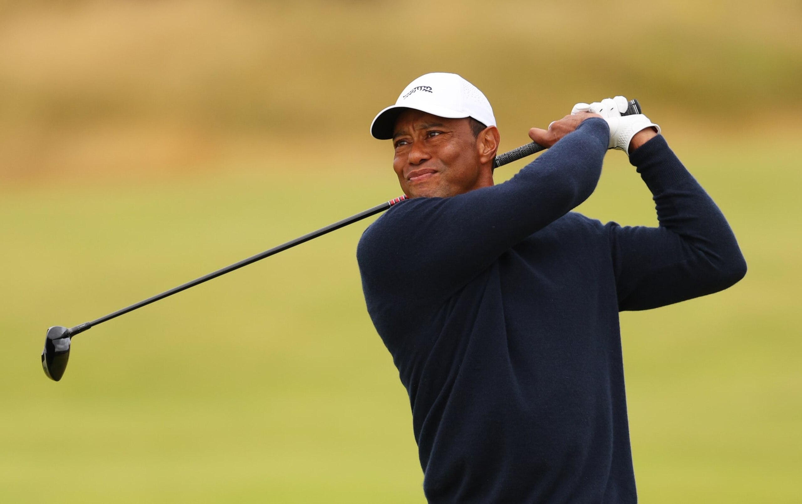 TROON, SCOTLAND - JULY 19: Tiger Woods of the United States plays his second shot on the fourth hole during day two of The 152nd Open championship at Royal Troon on July 19, 2024 in Troon, Scotland. (Photo by Andrew Redington/Getty Images)