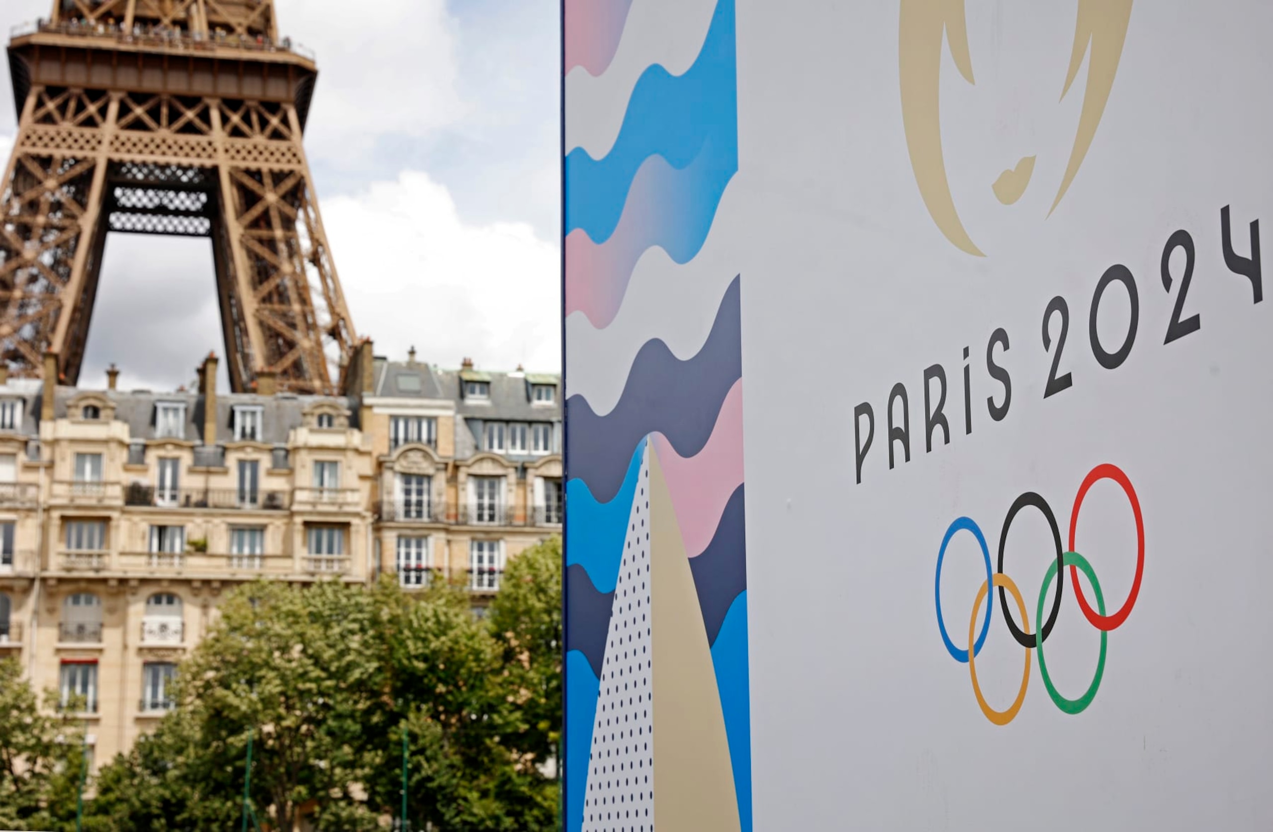 PARIS, FRANCE - JUNE 17: The Paris 2024 logo is displayed near the Eiffel Tower before the start of the Paris 2024 Olympic and Paralympic Games on June 17, 2024 in Paris, France. The city is gearing up to host the XXXIII Olympic Summer Games, from 26 July to 11 August. (Photo by Chesnot/Getty Images)