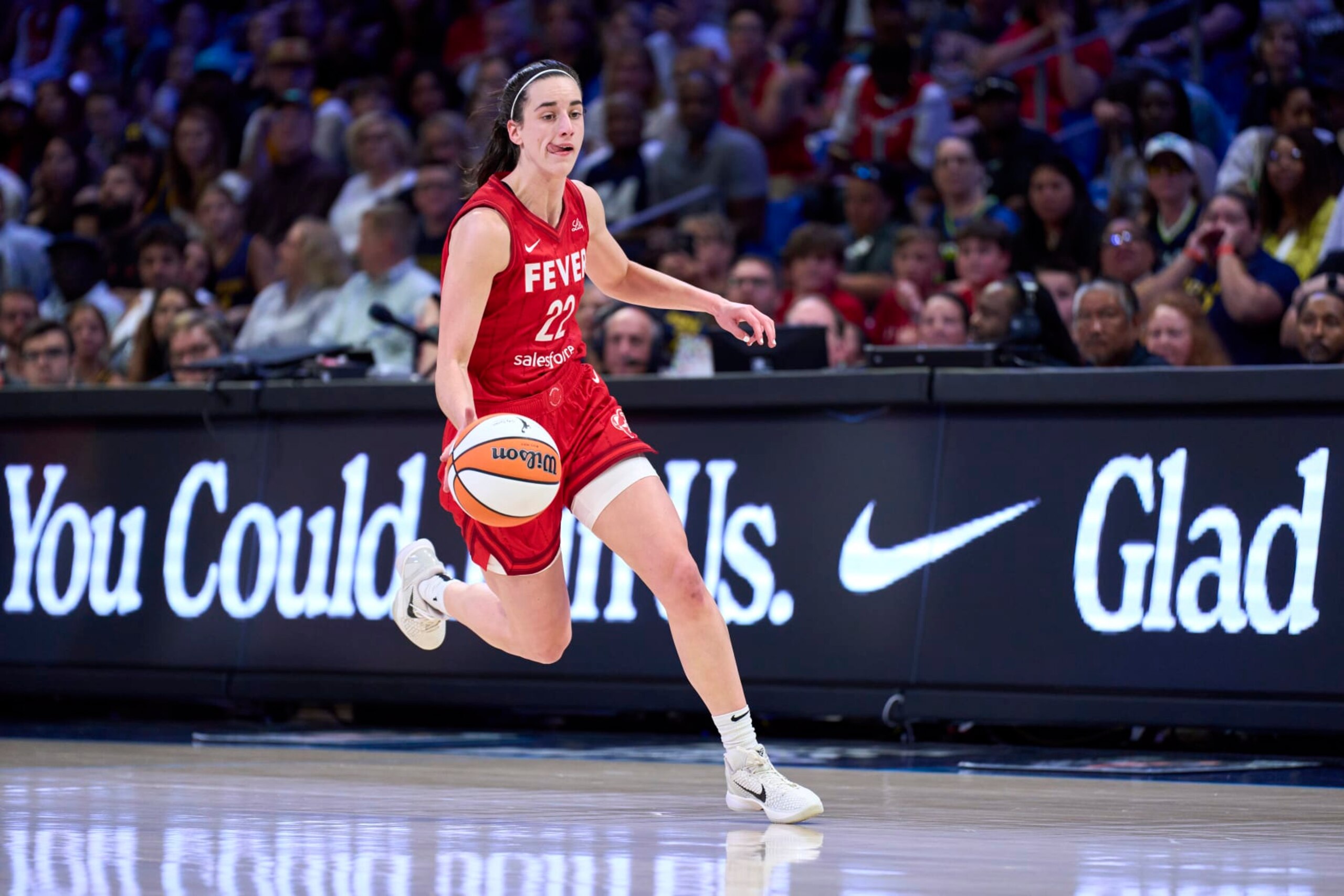 ARLINGTON, TEXAS - JULY 17: Caitlin Clark #22 of the Indiana Fever brings the ball up court against the Dallas Wings at the College Park Center on July 17, 2024 in Arlington, Texas. NOTE TO USER: User expressly acknowledges and agrees that, by downloading and or using this photograph, User is consenting to the terms and conditions of the Getty Images License Agreement. (Photo by Cooper Neill/Getty Images) ARLINGTON, TEXAS - JULY 17: Caitlin Clark #22 of the Indiana Fever brings the ball up court against the Dallas Wings at the College Park Center on July 17, 2024 in Arlington, Texas. NOTE TO USER: User expressly acknowledges and agrees that, by downloading and or using this photograph, User is consenting to the terms and conditions of the Getty Images License Agreement. (Photo by Cooper Neill/Getty Images)