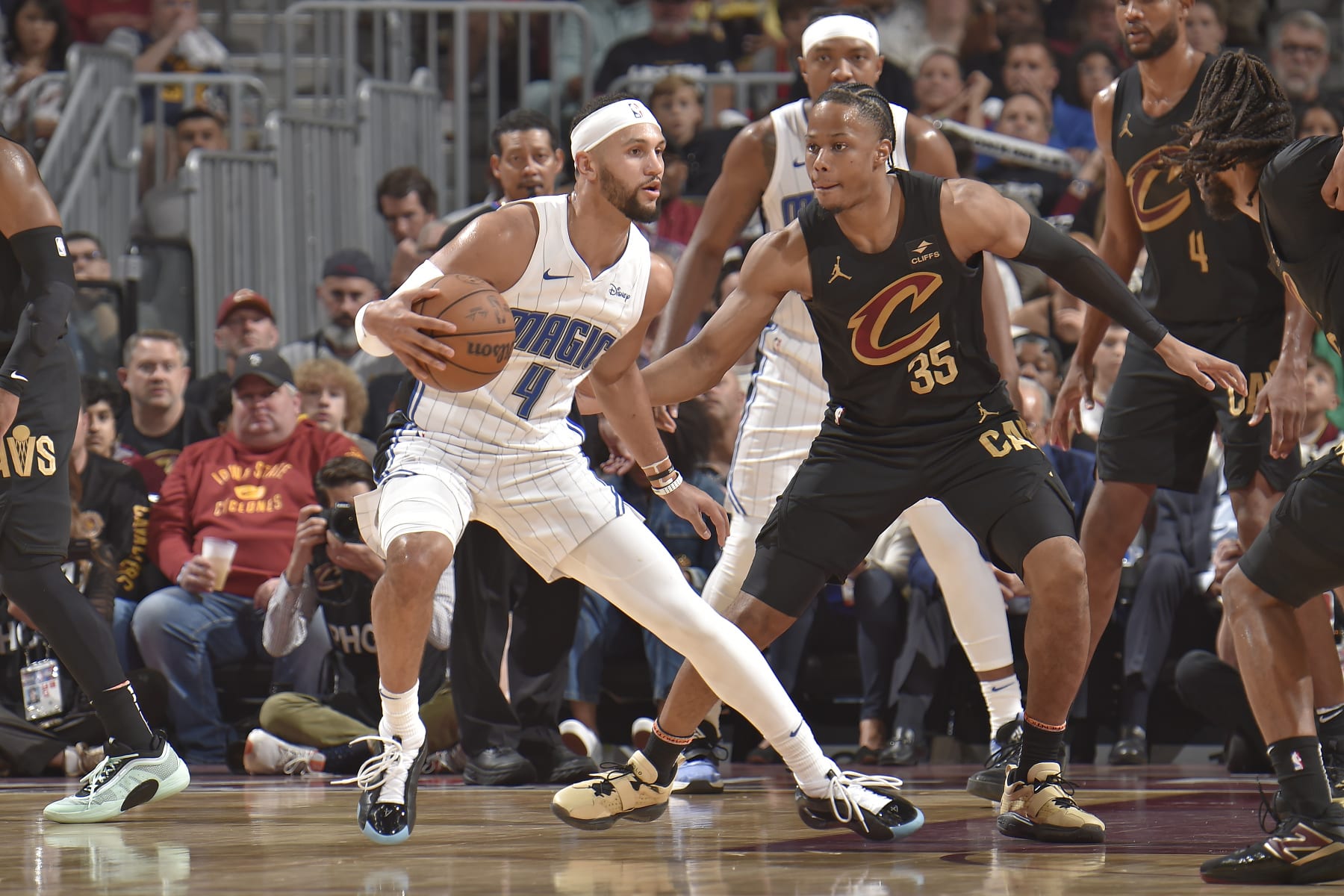 CLEVELAND, OH - MAY 5: Jalen Suggs #4 of the Orlando Magic handles the ball during the game against the Cleveland Cavaliers during Round 1 Game 7 of the 2024 NBA Playoffs on May 5, 2024 at Rocket Mortgage FieldHouse in Cleveland, Ohio. NOTE TO USER: User expressly acknowledges and agrees that, by downloading and/or using this Photograph, user is consenting to the terms and conditions of the Getty Images License Agreement. Mandatory Copyright Notice: Copyright 2024 NBAE (Photo by David Liam Kyle/NBAE via Getty Images)