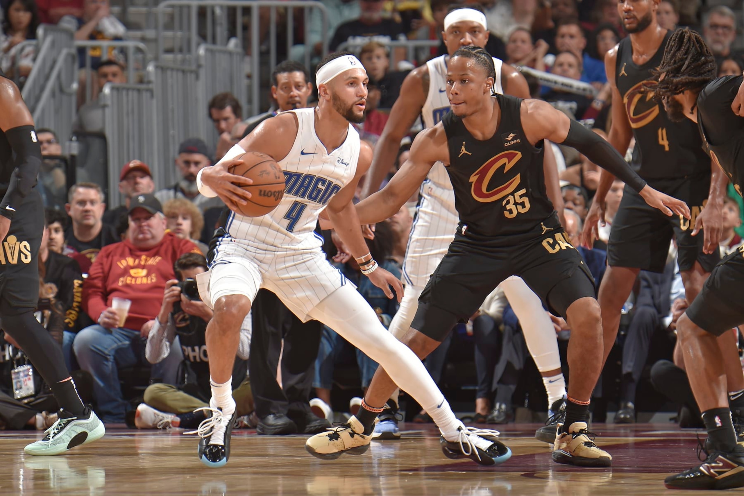 CLEVELAND, OH - MAY 5: Jalen Suggs #4 of the Orlando Magic handles the ball during the game against the Cleveland Cavaliers during Round 1 Game 7 of the 2024 NBA Playoffs on May 5, 2024 at Rocket Mortgage FieldHouse in Cleveland, Ohio. NOTE TO USER: User expressly acknowledges and agrees that, by downloading and/or using this Photograph, user is consenting to the terms and conditions of the Getty Images License Agreement. Mandatory Copyright Notice: Copyright 2024 NBAE (Photo by David Liam Kyle/NBAE via Getty Images)
