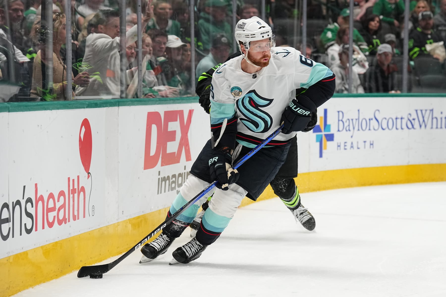 DALLAS, TX - APRIL 13: Adam Larsson #6 of the Seattle Kraken handles the puck against the Dallas Stars at the American Airlines Center on April 13, 2024 in Dallas, Texas. (Photo by Glenn James/NHLI via Getty Images)