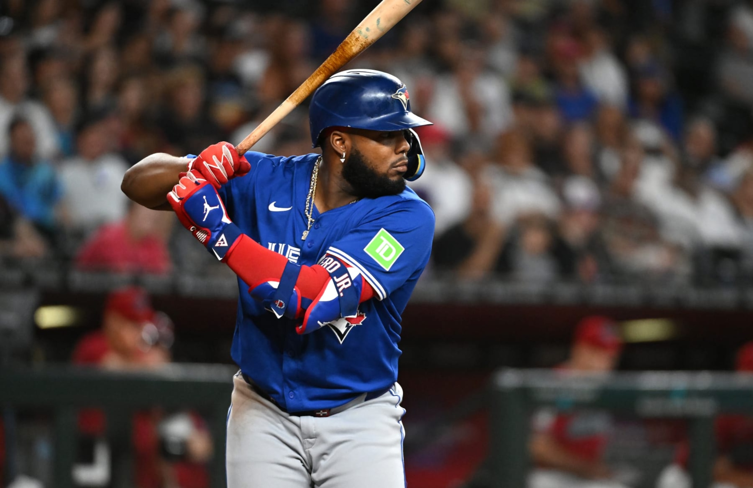 PHOENIX, ARIZONA - JULY 14: Vladimir Guerrero Jr #27 of the Toronto Blue Jays gets ready in the batters box against the Arizona Diamondbacks at Chase Field on July 14, 2024 in Phoenix, Arizona. (Photo by Norm Hall/Getty Images) PHOENIX, ARIZONA - JULY 14: Vladimir Guerrero Jr #27 of the Toronto Blue Jays gets ready in the batters box against the Arizona Diamondbacks at Chase Field on July 14, 2024 in Phoenix, Arizona. (Photo by Norm Hall/Getty Images)