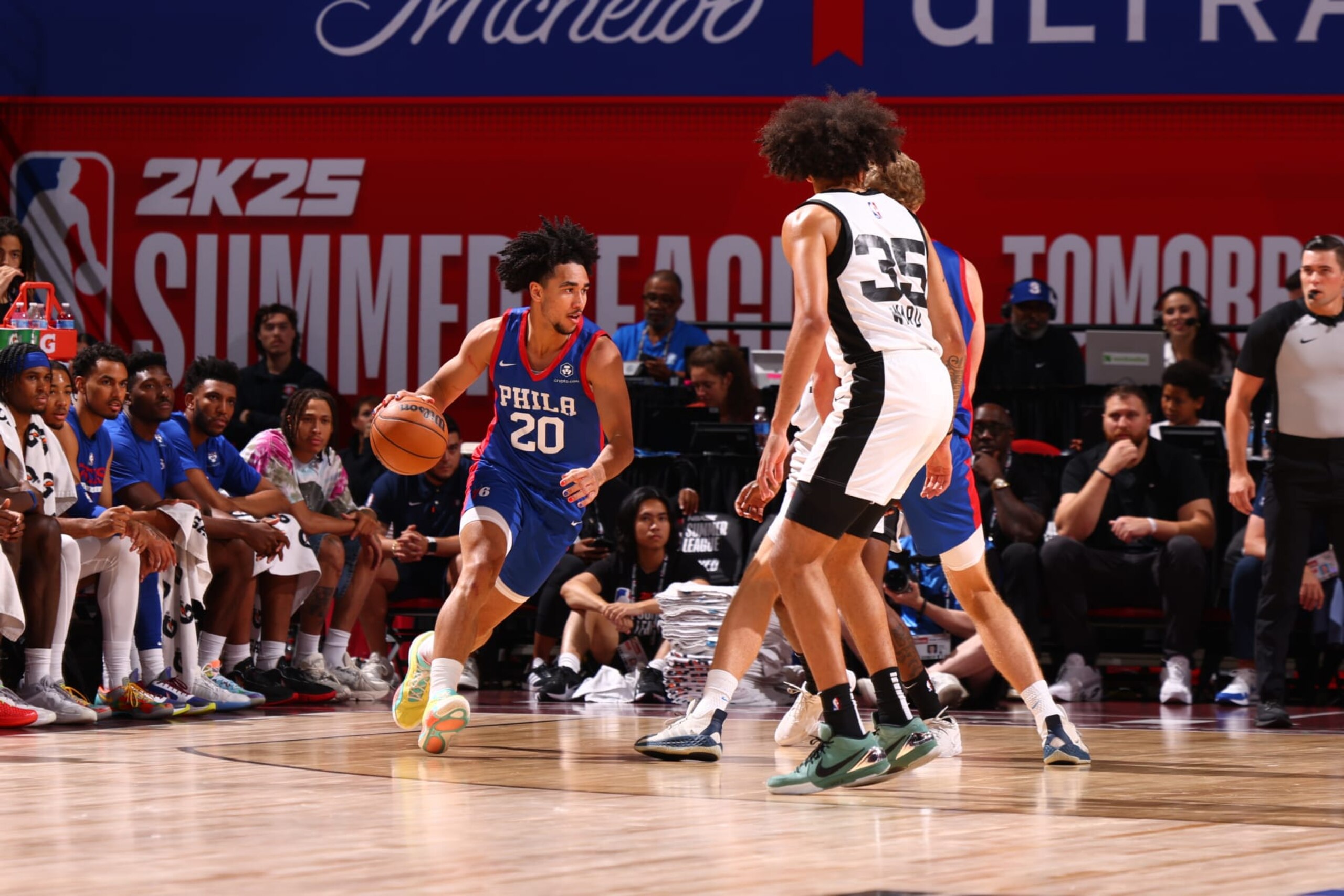 LAS VEGAS, NV - JULY 19: Jared McCain #20 of the Philadelphia 76ers drives to the basket during the game against the San Antonio Spurs on July 19, 2024 at the Thomas & Mack Center in Las Vegas, Nevada. NOTE TO USER: User expressly acknowledges and agrees that, by downloading and or using this photograph, User is consenting to the terms and conditions of the Getty Images License Agreement. Mandatory Copyright Notice: Copyright 2023 NBAE (Photo by Zach Beeker/NBAE via Getty Images) LAS VEGAS, NV - JULY 19: Jared McCain #20 of the Philadelphia 76ers drives to the basket during the game against the San Antonio Spurs on July 19, 2024 at the Thomas & Mack Center in Las Vegas, Nevada. NOTE TO USER: User expressly acknowledges and agrees that, by downloading and or using this photograph, User is consenting to the terms and conditions of the Getty Images License Agreement. Mandatory Copyright Notice: Copyright 2023 NBAE (Photo by Zach Beeker/NBAE via Getty Images)