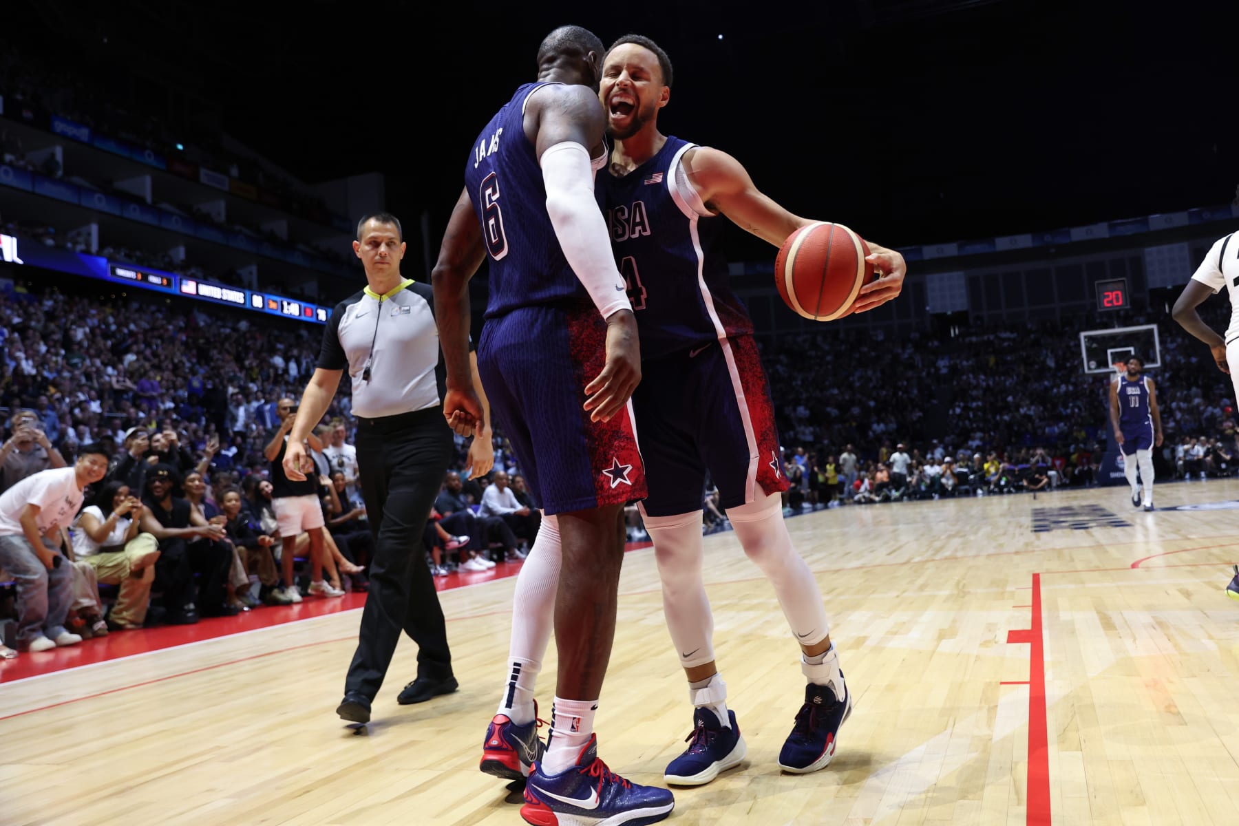 LONDON, ENGLAND - JULY 20: LeBron James #6 and Stephen Curry #4 of Team USA celebrate during the game against South Sudan as part of the 2024 USA Basketball Showcase on July 20, 2024 in London, England at O2 Arena. NOTE TO USER: User expressly acknowledges and agrees that, by downloading and/or using this photograph, user is consenting to the terms and conditions of the Getty Images License Agreement. Mandatory Copyright Notice: Copyright 2024 NBAE (Photo by Joe Murphy/NBAE via Getty Images)
