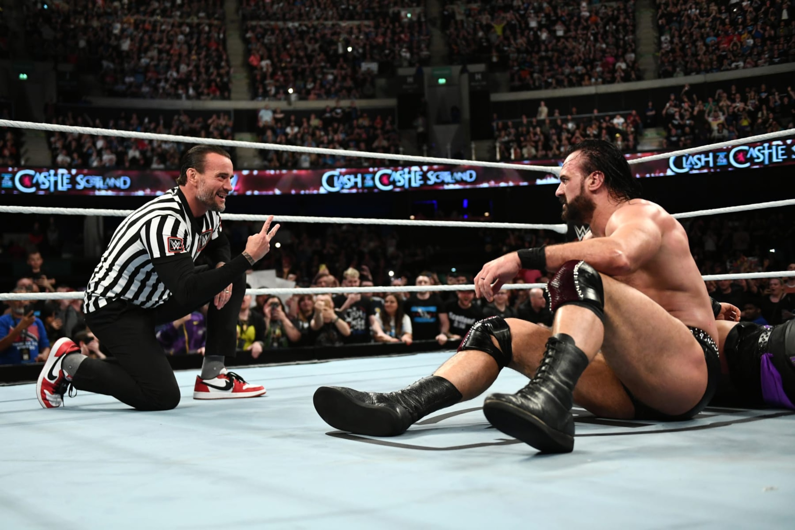 GLASGOW, SCOTLAND - JUNE 15: CM Punk taunts Drew McIntyre after Punk interfered with McIntyre's match against Damian Priest during WWE's Clash at the Castle, Premium Live Event at The OVO Hydro on June 15, 2024 in Glasgow, Scotland.  (Photo by WWE/Getty Images)