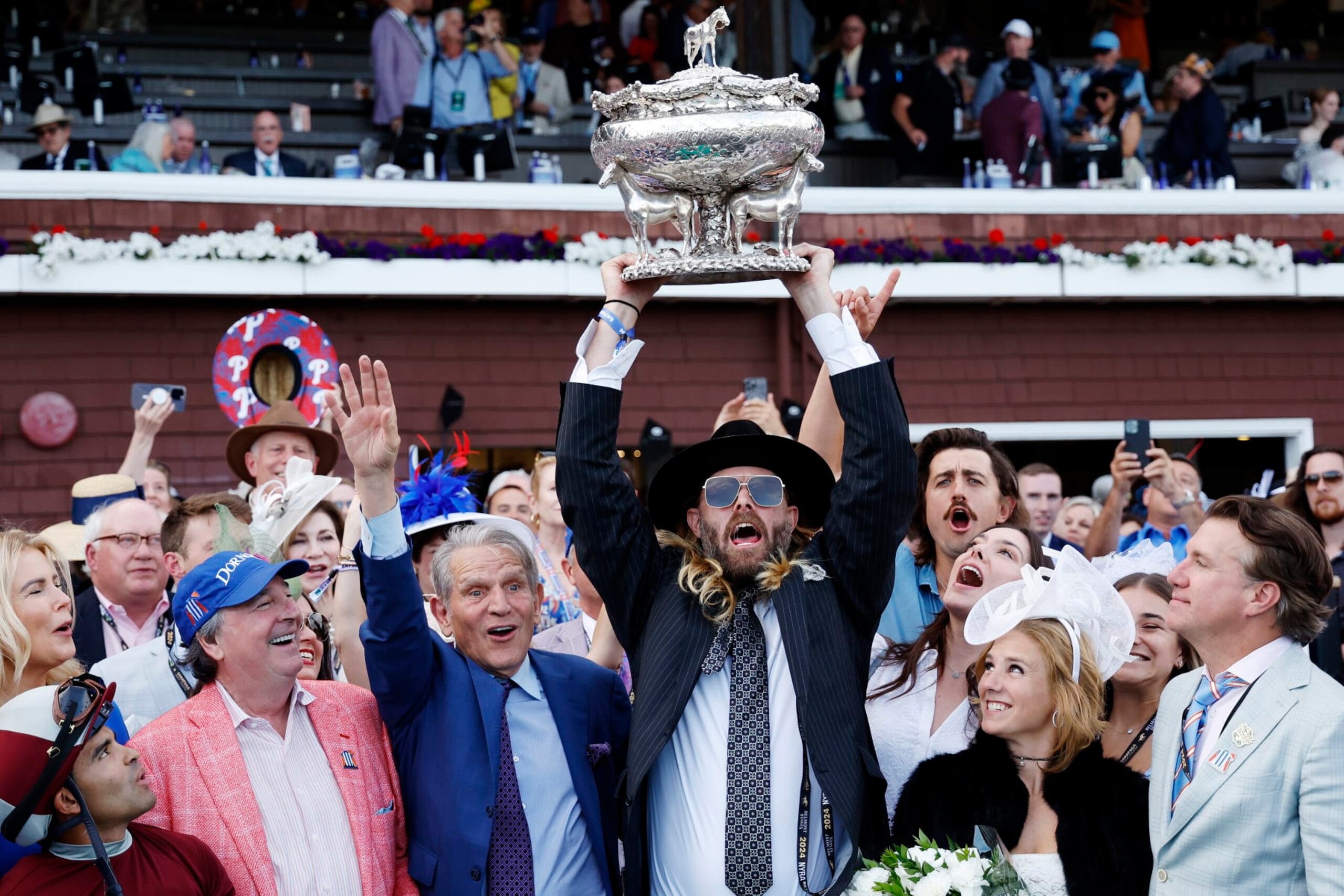 SARATOGA SPRINGS, NEW YORK - JUNE 08: Owner Jayson Werth (C) raises the trophy after Dornoch with Luis Saez up wins the 156th running of the Belmont Stakes at Saratoga Race Course on June 08, 2024 in Saratoga Springs, New York. The race was moved to Saratoga while Belmont Park undergoes renovations. (Photo by Sarah Stier/Getty Images) SARATOGA SPRINGS, NEW YORK - JUNE 08: Owner Jayson Werth (C) raises the trophy after Dornoch with Luis Saez up wins the 156th running of the Belmont Stakes at Saratoga Race Course on June 08, 2024 in Saratoga Springs, New York. The race was moved to Saratoga while Belmont Park undergoes renovations. (Photo by Sarah Stier/Getty Images)