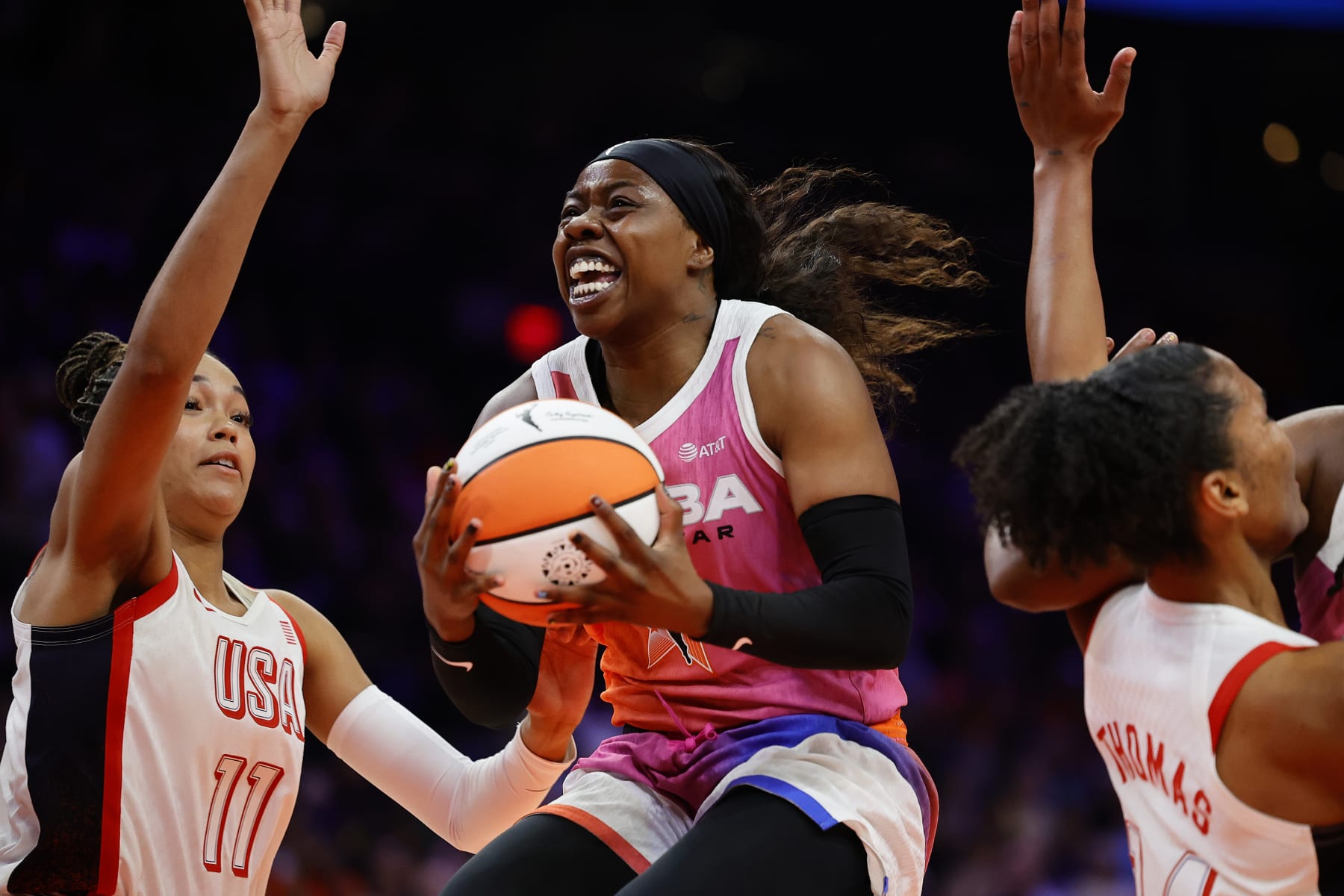 PHOENIX, ARIZONA - JULY 20: Arike Ogunbowale #24 of Team WNBA goes up over Napheesa Collier #11 of Team USA during the second half of the 2024 WNBA All Star Game at Footprint Center on July 20, 2024 in Phoenix, Arizona.  (Photo by Alex Slitz/Getty Images)