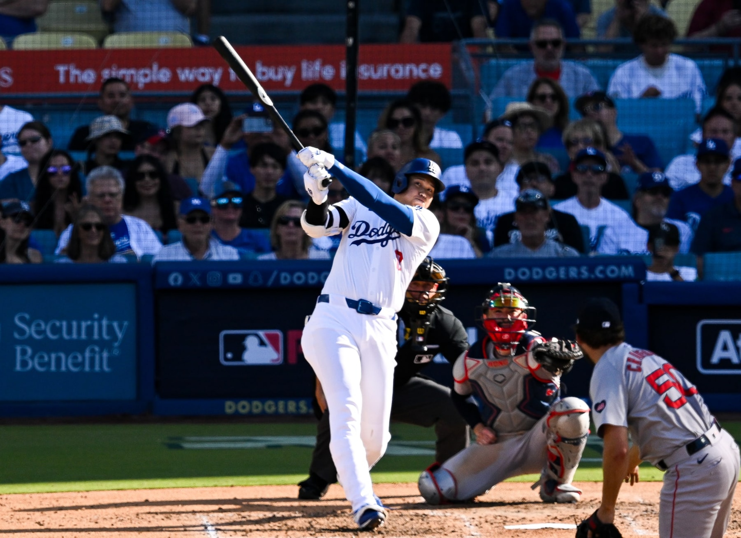 LOS ANGELES, CALIFORNIA - JULY 21: Shohei Ohtani #17 of Los Angeles Dodgers hits a solo homerun in the bottom of the fifth inning during the regular season game between Boston Red Sox and Los Angeles Dodgers at Dodger Stadium on July 21, 2024 in Los Angeles, California. (Photo by Gene Wang/Getty Images)