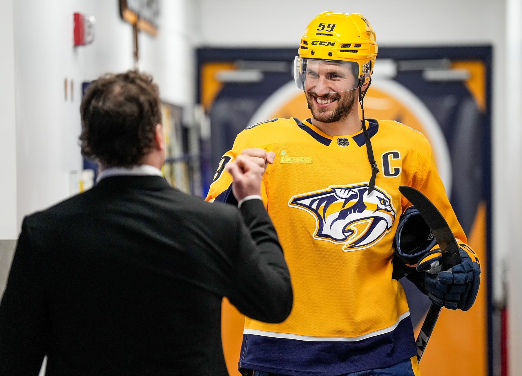 NASHVILLE, TENNESSEE - APRIL 2: Tyson Barrie #22 fist bumps Roman Josi #59 of the Nashville Predators prior to an NHL game against the Boston Bruins at Bridgestone Arena on April 2, 2024 in Nashville, Tennessee. (Photo by John Russell/NHLI via Getty Images)