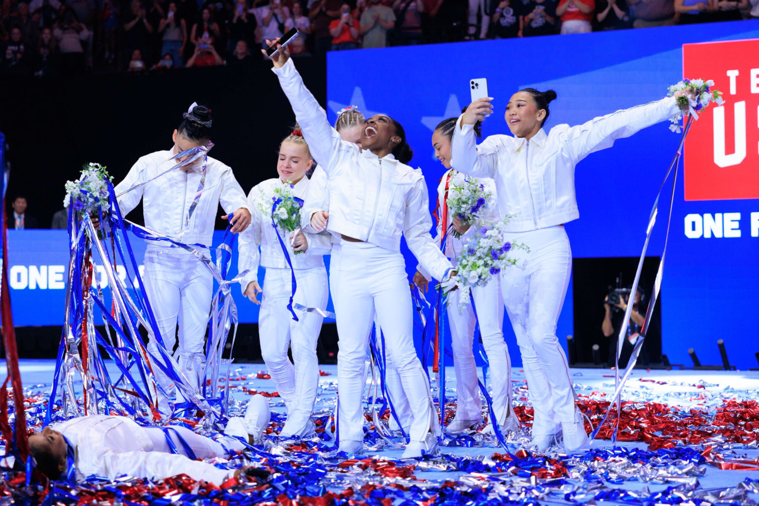MINNEAPOLIS, UNITED STATES - JUNE 30: Jordan Chiles, Leanne Wong (alternate), Joscelyn Roberson (alternate), Jade Carey, Simone Biles, Hezly Rivera, and Suni Lee stand after being named at the U.S. Olympic Team for women's gymnastics at Target Center in Minneapolis, United States on June 30, 2024. (Photo by Nikolas Liepins/Anadolu via Getty Images) MINNEAPOLIS, UNITED STATES - JUNE 30: Jordan Chiles, Leanne Wong (alternate), Joscelyn Roberson (alternate), Jade Carey, Simone Biles, Hezly Rivera, and Suni Lee stand after being named at the U.S. Olympic Team for women's gymnastics at Target Center in Minneapolis, United States on June 30, 2024. (Photo by Nikolas Liepins/Anadolu via Getty Images)