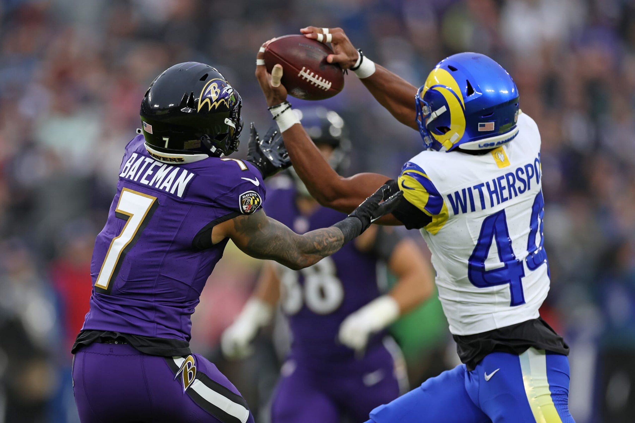 BALTIMORE, MARYLAND - DECEMBER 10: Ahkello Witherspoon #44 of the Los Angeles Rams intercepts a pass intended for Rashod Bateman #7 of the Baltimore Ravens during the first half  at M&T Bank Stadium on December 10, 2023 in Baltimore, Maryland. (Photo by Todd Olszewski/Getty Images)