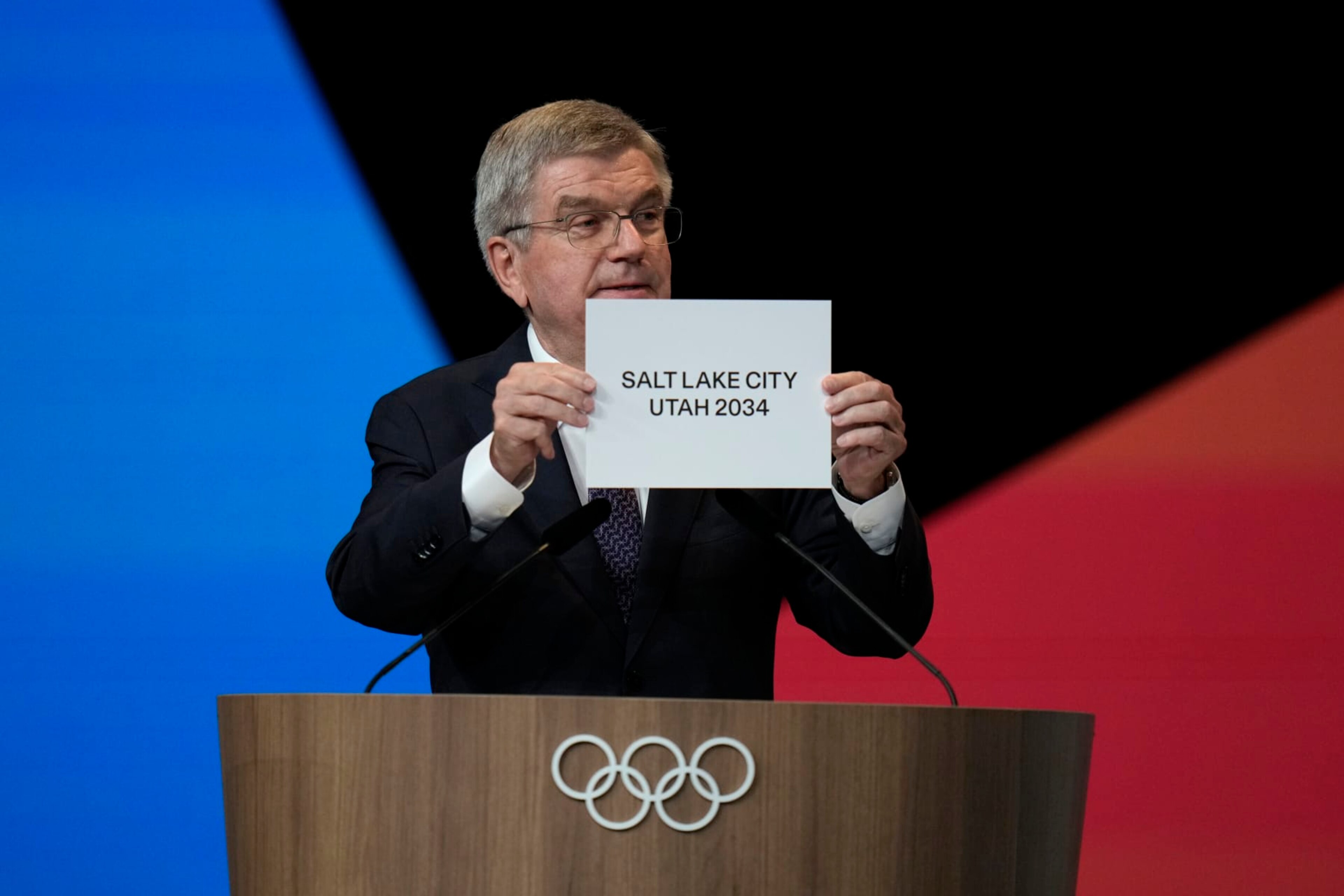 PARIS, FRANCE - JULY 24: IOC president Thomas Bach holds the board Salt Lake City during the 142nd IOC session at the 2024 Summer Olympics on July 24, 2024 in Paris, France. Salt Lake City was confirmed as host for the 2034 Winter Games by International Olympic Committee. (Photo by Natacha Pisarenko - Pool/Getty Images) PARIS, FRANCE - JULY 24: IOC president Thomas Bach holds the board Salt Lake City during the 142nd IOC session at the 2024 Summer Olympics on July 24, 2024 in Paris, France. Salt Lake City was confirmed as host for the 2034 Winter Games by International Olympic Committee. (Photo by Natacha Pisarenko - Pool/Getty Images)