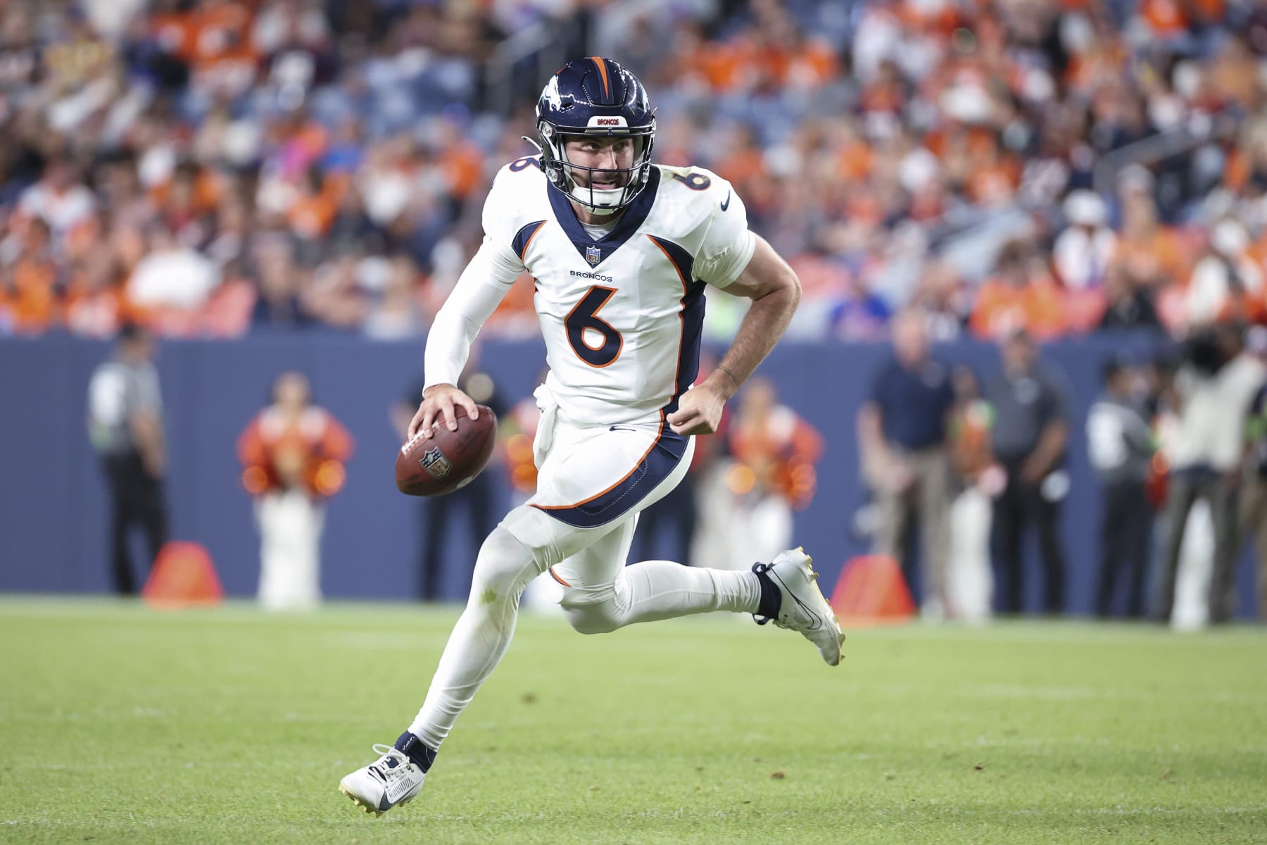 DENVER, COLORADO - AUGUST 26: Ben DiNucci #6 of the Denver Broncos scrambles in the second half of a preseason game against the Los Angeles Rams at Empower Field At Mile High on August 26, 2023 in Denver, Colorado. (Photo by Tyler Schank/Getty Images)