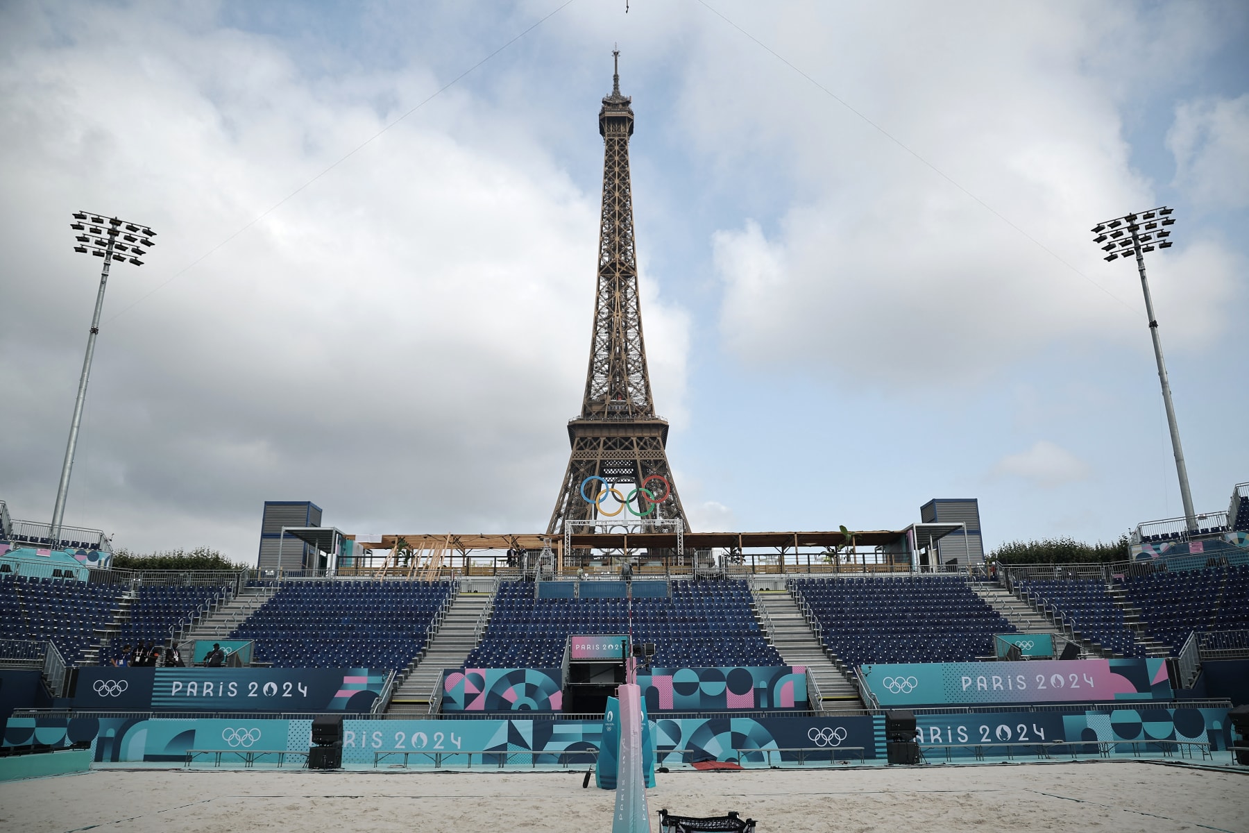 This photograph taken on Champ-de-Mars in Paris, France, on 24 July 2024, shows the "Stade Tour Eiffel" ahead of the Paris 2024 Olympic and Paralympic games. The "Stade Tour Eiffel" will host beach volleyball and blind football games during the 2024 Paris Olympics. (Photo by Christophe PETIT TESSON / POOL / AFP) (Photo by CHRISTOPHE PETIT TESSON/POOL/AFP via Getty Images)