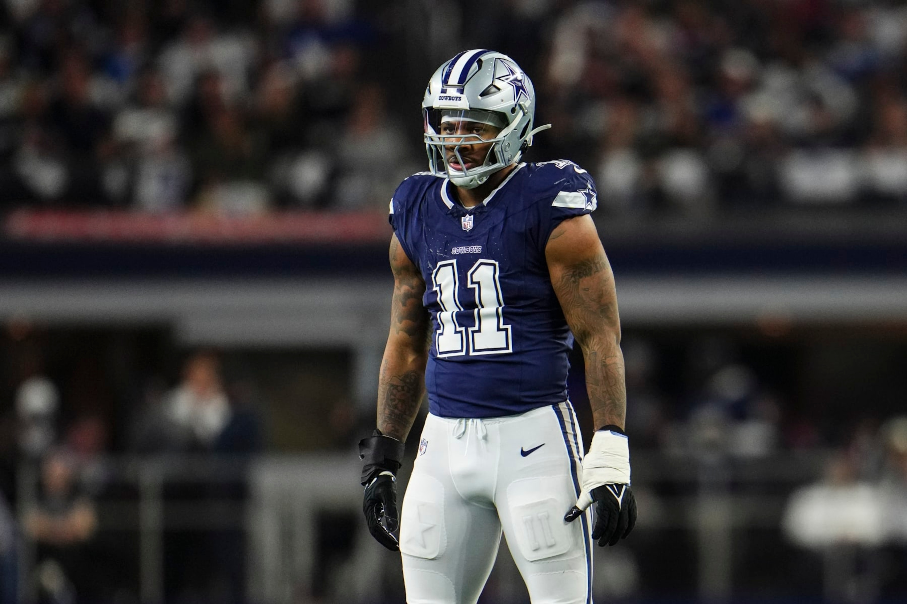 ARLINGTON, TX - DECEMBER 30: Micah Parsons #11 of the Dallas Cowboys looks on from the field during an NFL football game against the Detroit Lions at AT&T Stadium on December 30, 2023 in Arlington, Texas. (Photo by Cooper Neill/Getty Images) ARLINGTON, TX - DECEMBER 30: Micah Parsons #11 of the Dallas Cowboys looks on from the field during an NFL football game against the Detroit Lions at AT&T Stadium on December 30, 2023 in Arlington, Texas. (Photo by Cooper Neill/Getty Images)
