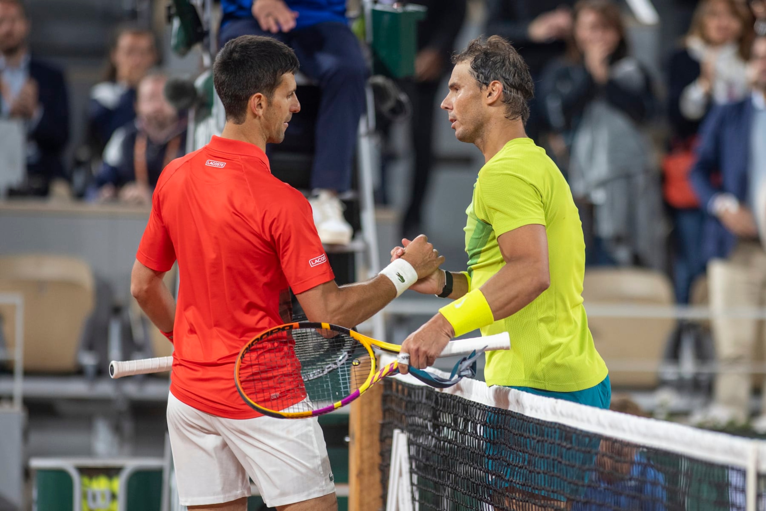 PARIS, FRANCE May 31. Winner Rafael Nadal of Spain is congratulated at the net by Novak Djokovic of Serbia on Court Philippe Chatrier during the singles Quarter Final match at the 2022 French Open Tennis Tournament at Roland Garros on May 31st 2022 in Paris, France. (Photo by Tim Clayton/Corbis via Getty Images) PARIS, FRANCE May 31. Winner Rafael Nadal of Spain is congratulated at the net by Novak Djokovic of Serbia on Court Philippe Chatrier during the singles Quarter Final match at the 2022 French Open Tennis Tournament at Roland Garros on May 31st 2022 in Paris, France. (Photo by Tim Clayton/Corbis via Getty Images)