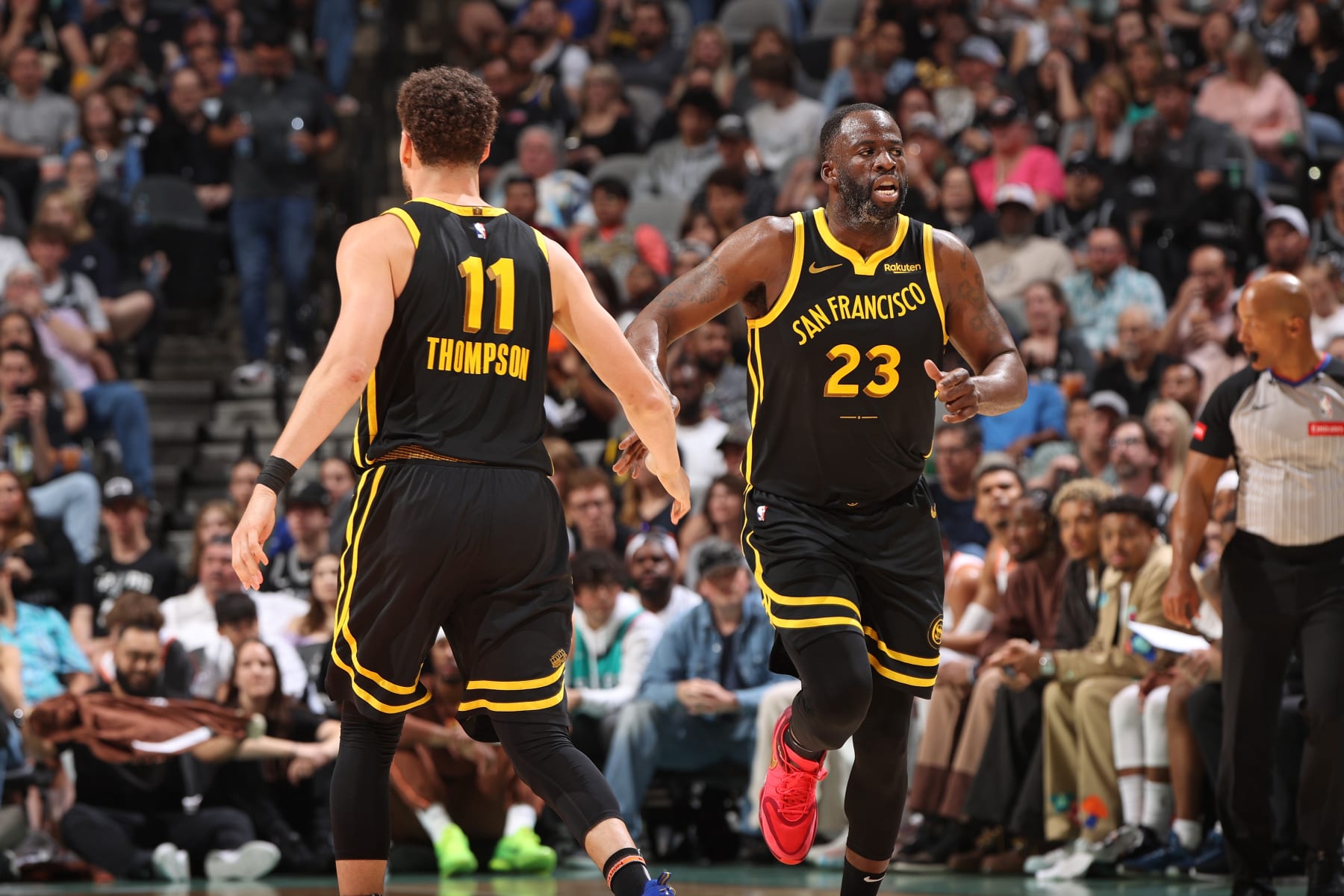 SAN ANTONIO, TX - MARCH 31:  Klay Thompson #11 and Draymond Green #23 of the Golden State Warriors high fives during the game against the San Antonio Spurs on March 31, 2024 at the Frost Bank Center in San Antonio, Texas. NOTE TO USER: User expressly acknowledges and agrees that, by downloading and or using this photograph, user is consenting to the terms and conditions of the Getty Images License Agreement. Mandatory Copyright Notice: Copyright 2024 NBAE (Photos by Joe Murphy/NBAE via Getty Images)