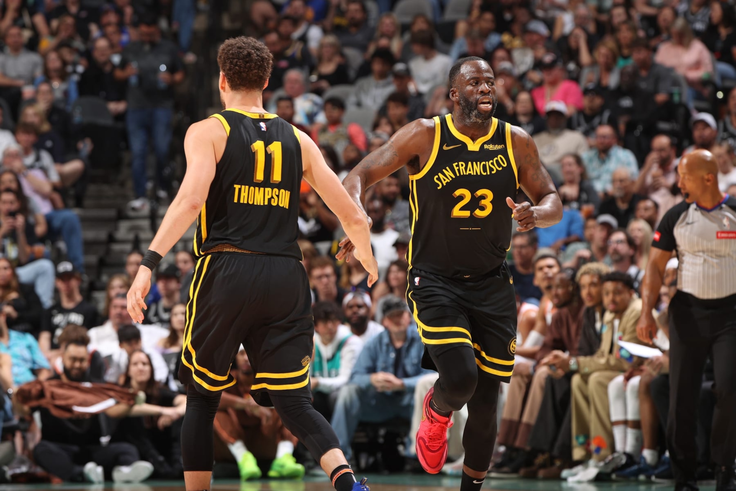 SAN ANTONIO, TX - MARCH 31:  Klay Thompson #11 and Draymond Green #23 of the Golden State Warriors high fives during the game against the San Antonio Spurs on March 31, 2024 at the Frost Bank Center in San Antonio, Texas. NOTE TO USER: User expressly acknowledges and agrees that, by downloading and or using this photograph, user is consenting to the terms and conditions of the Getty Images License Agreement. Mandatory Copyright Notice: Copyright 2024 NBAE (Photos by Joe Murphy/NBAE via Getty Images)