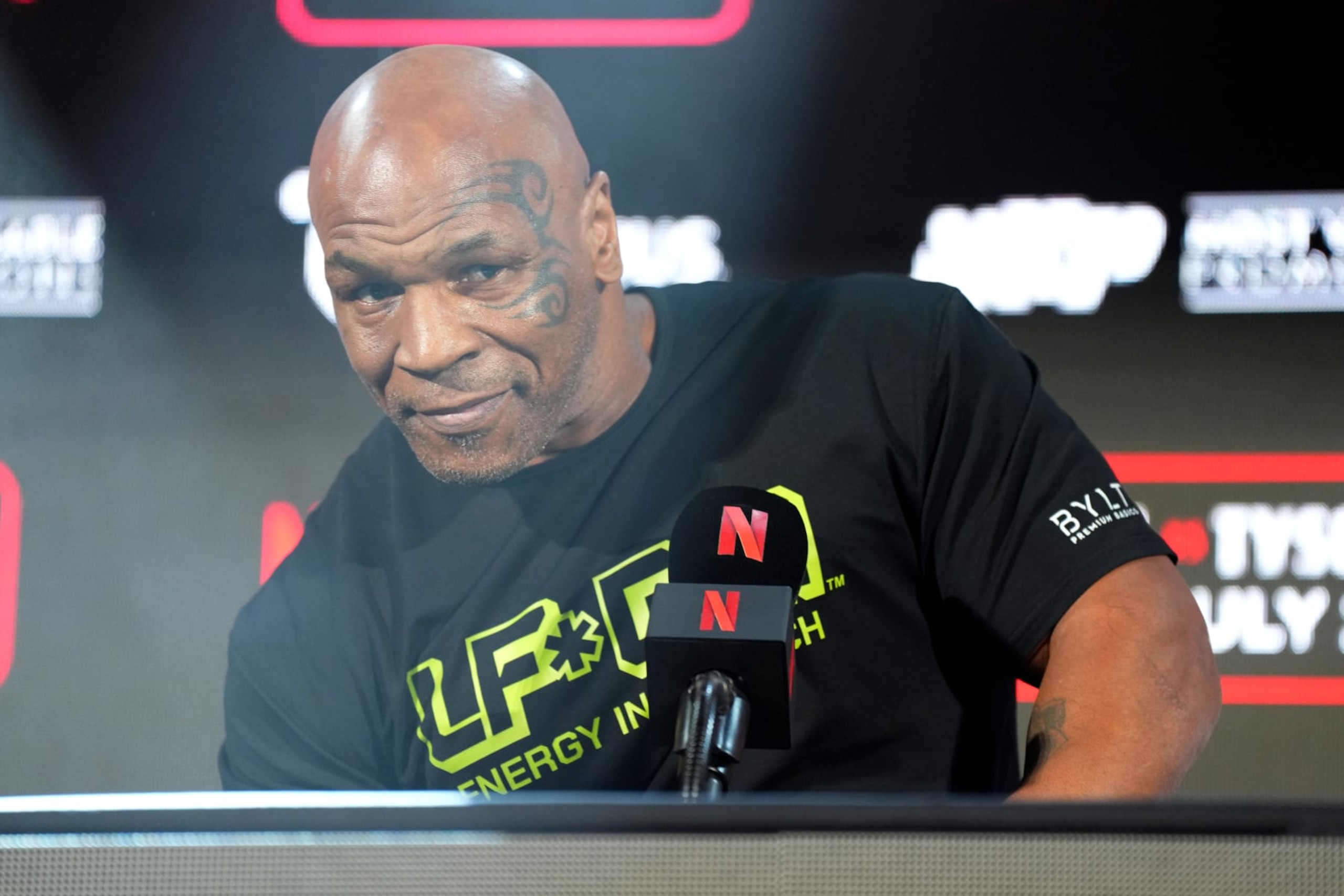 ARLINGTON, TEXAS - MAY 16: Mike Tyson speaks onstage during the Jake Paul vs. Mike Tyson Boxing match Arlington press conference at Texas Live! on May 16, 2024 in Arlington, Texas.  (Photo by Cooper Neill/Getty Images for Netflix)