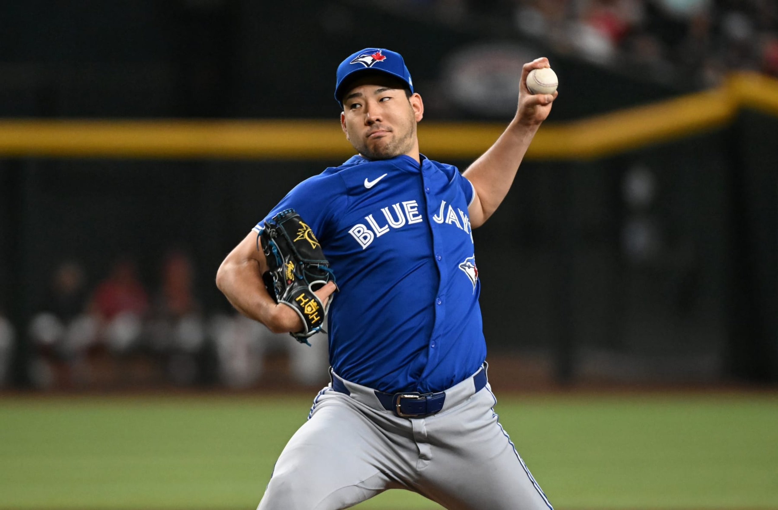 PHOENIX, ARIZONA - JULY 14: Yusei Kikuchi #16 of the Toronto Blue Jays delivers a first inning pitch against the Arizona Diamondbacks at Chase Field on July 14, 2024 in Phoenix, Arizona. (Photo by Norm Hall/Getty Images)