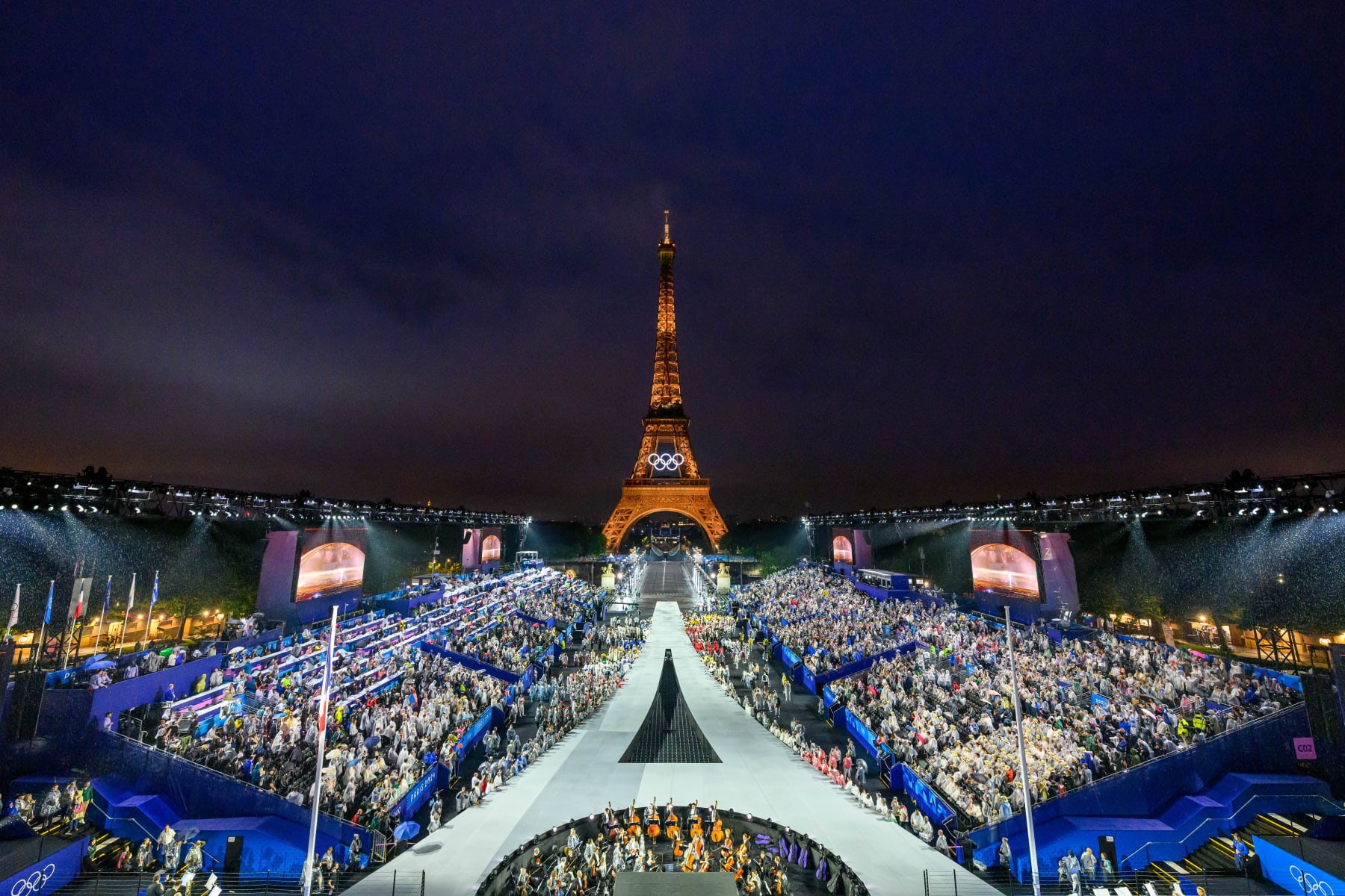 PARIS, FRANCE - JULY 26: Overview of the Trocadero venue while the delegations arrive, during the opening ceremony of the Paris 2024 Olympic Games, as the Eiffel Tower is seen in the background, on July 26, 2024 on July 26, 2024 in Paris, France. (Photo by François-Xavier Marit - Pool/Getty Images)
