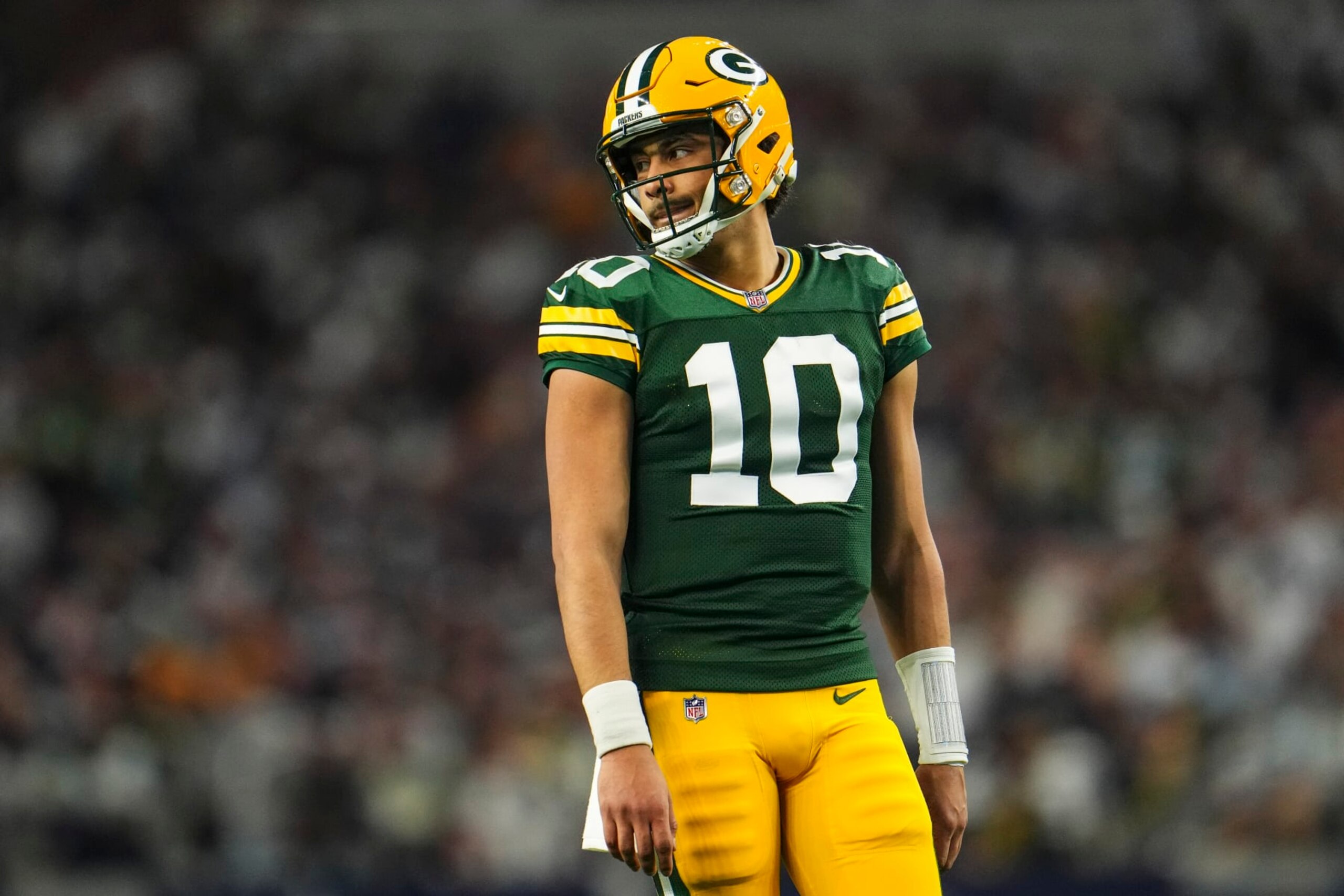 DALLAS, TX - JANUARY 14: Jordan Love #10 of the Green Bay Packers looks on from the field during an NFL wild-card playoff football game against the Dallas Cowboys at AT&T Stadium on January 14, 2024 in Dallas, Texas. (Photo by Cooper Neill/Getty Images)