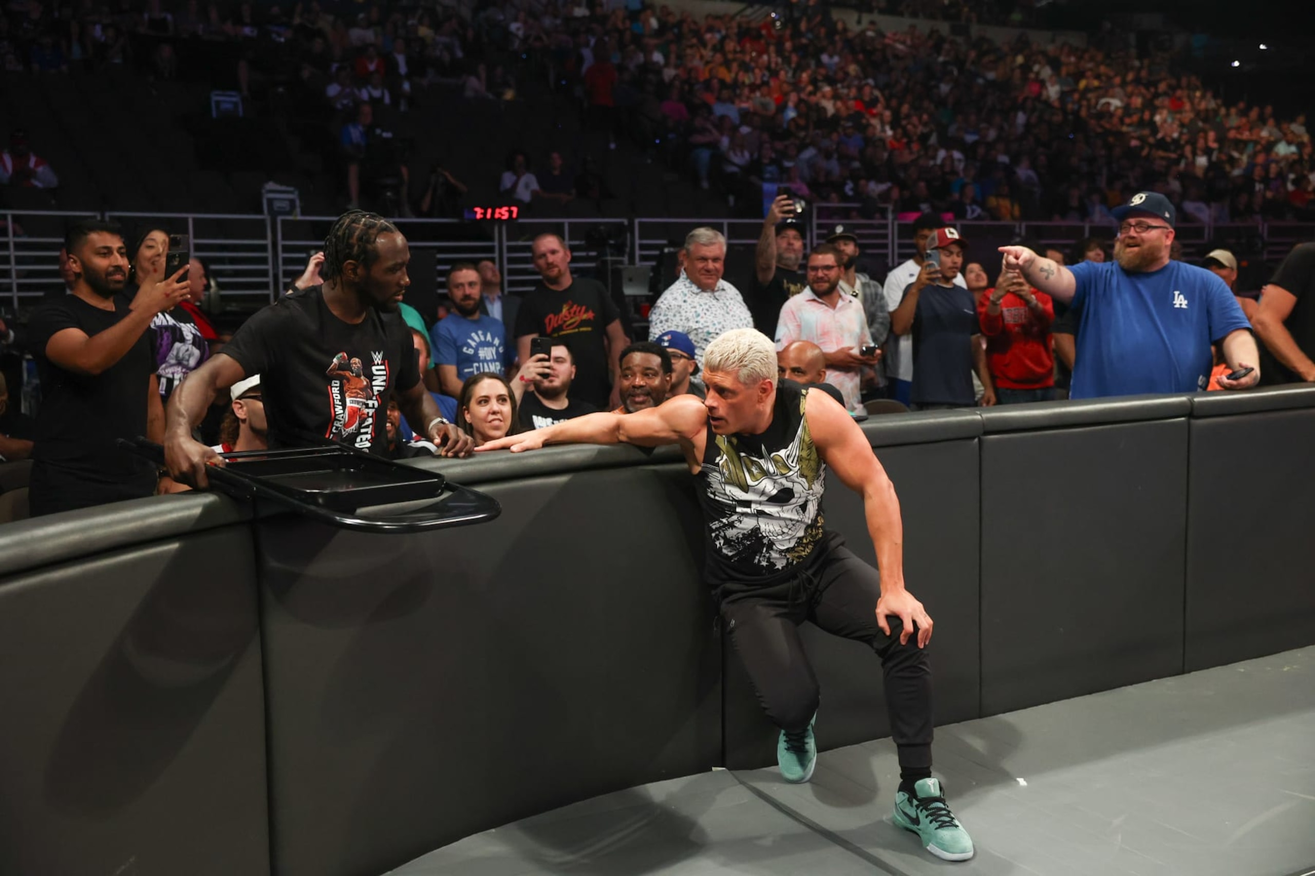 OMAHA, NEBRASKA - JULY 19: Boxer Terence Crawford passes Cody Rhodes a steel chair during SmackDown at CHI Health Center on July 19, 2024 in Omaha, Nebraska. (Photo by WWE/Getty Images) OMAHA, NEBRASKA - JULY 19: Boxer Terence Crawford passes Cody Rhodes a steel chair during SmackDown at CHI Health Center on July 19, 2024 in Omaha, Nebraska. (Photo by WWE/Getty Images)