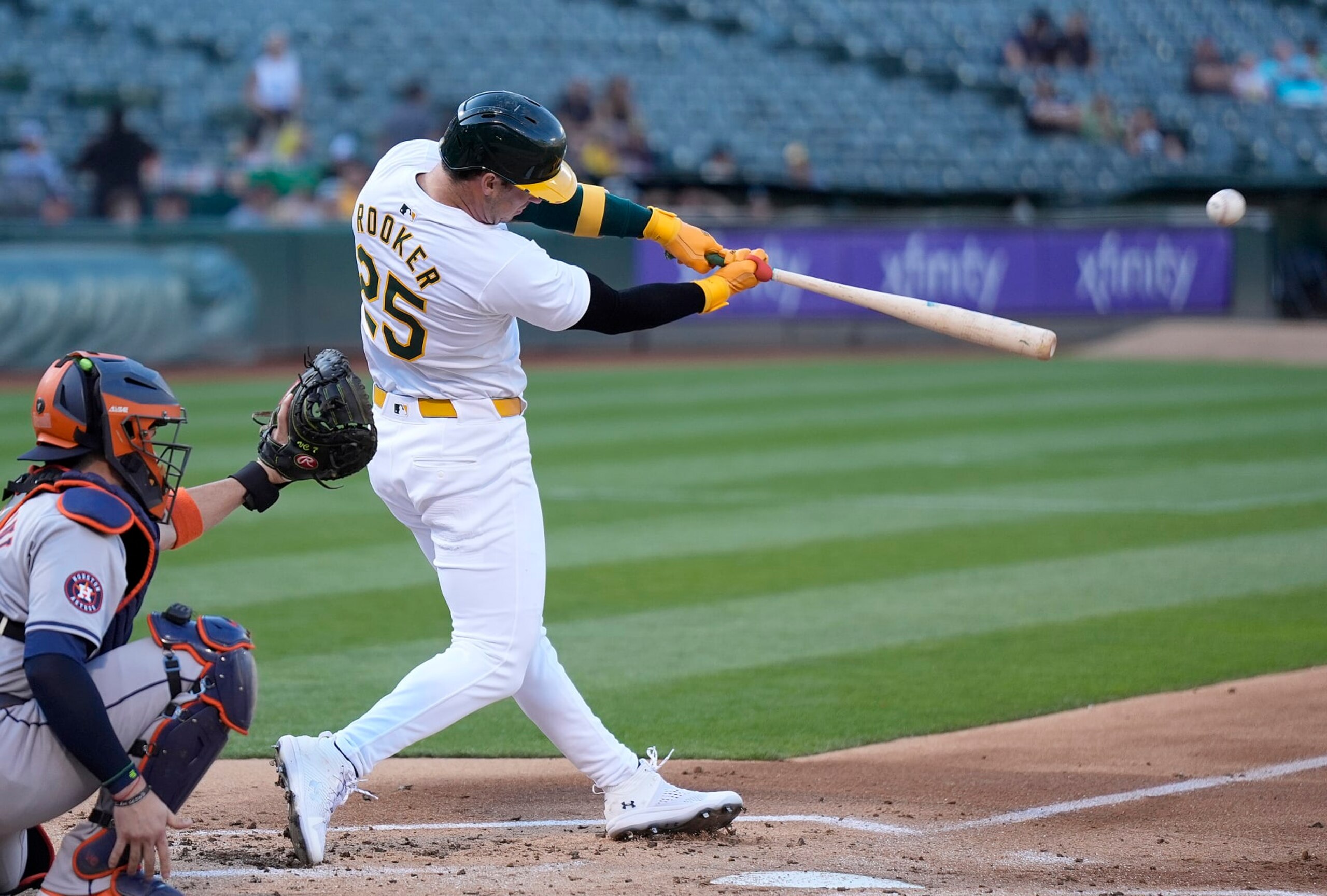 OAKLAND, CALIFORNIA - JULY 23: Brent Rooker #25 of the Oakland Athletics hits a two-run home run against the Houston Astros in the bottom of the first inning on July 23, 2024 at the Oakland Coliseum in Oakland, California. (Photo by Thearon W. Henderson/Getty Images)