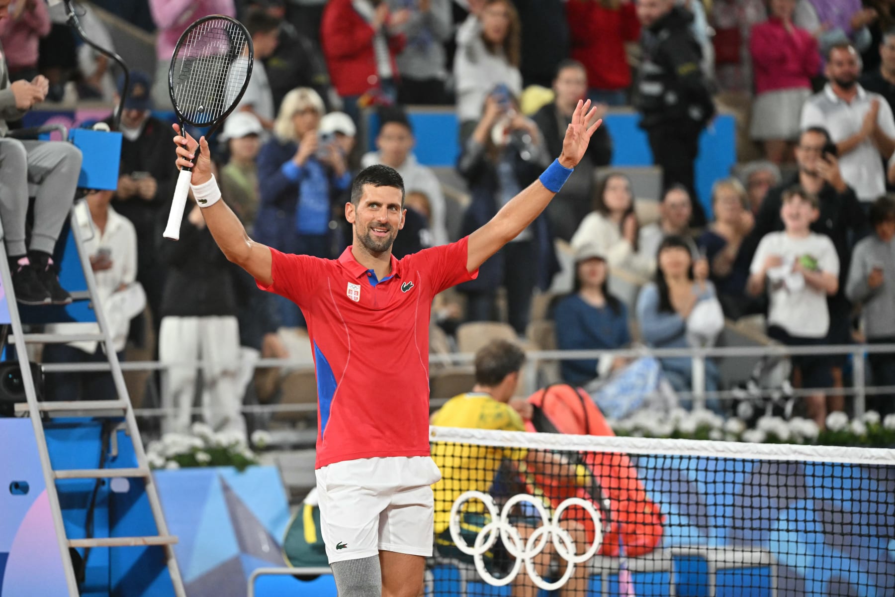 Serbia's Novak Djokovic reacts after his win over Australia's Matthew Ebden in their men's singles first round tennis match on Court Philippe-Chatrier at the Roland-Garros Stadium at the Paris 2024 Olympic Games, in Paris on July 27, 2024. (Photo by Miguel MEDINA / AFP) (Photo by MIGUEL MEDINA/AFP via Getty Images)