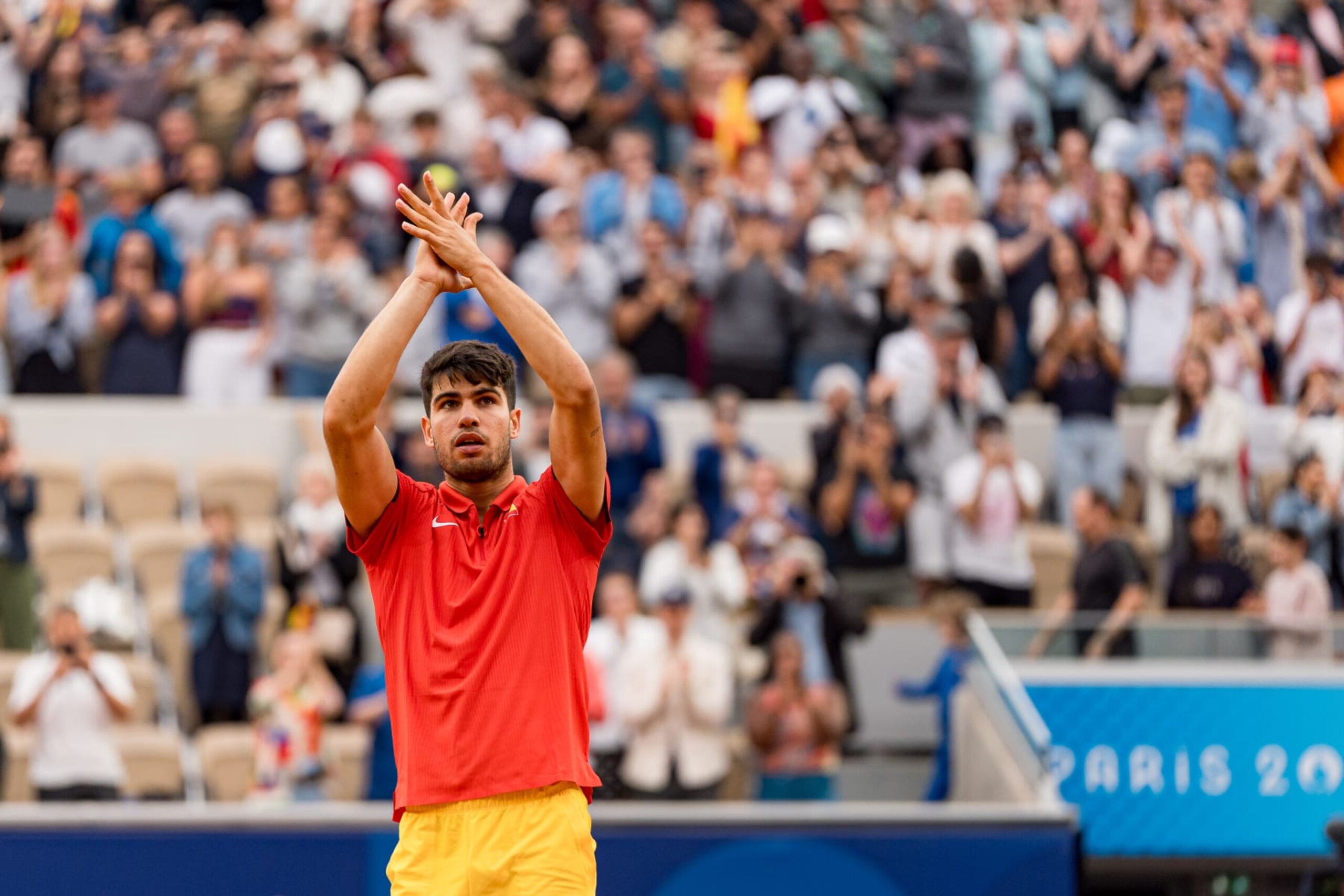 PARIS, FRANCE - JULY 27: Carlos Alcaraz of Team Spain celebrates after winning match point against Hady Habib of Team Lebanon during the Men's Singles First Round match on day one of the Olympic Games Paris 2024 at Roland Garros on July 27, 2024 in Paris, France. (Photo by Andy Cheung/Getty Images)