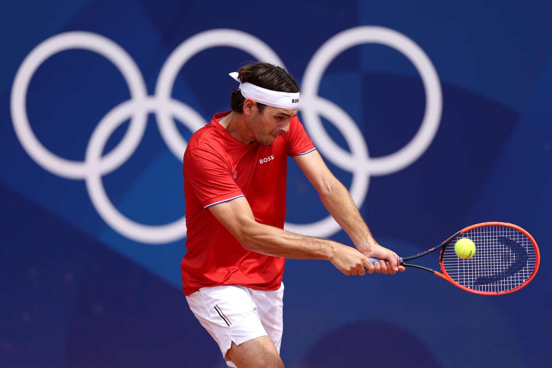 PARIS, FRANCE - JULY 25: Taylor Fritz of Team United States plays a backhand during a tennis training session at Roland-Garros ahead of the Paris Olympic Games on July 25, 2024 in Paris, France. (Photo by Matthew Stockman/Getty Images)