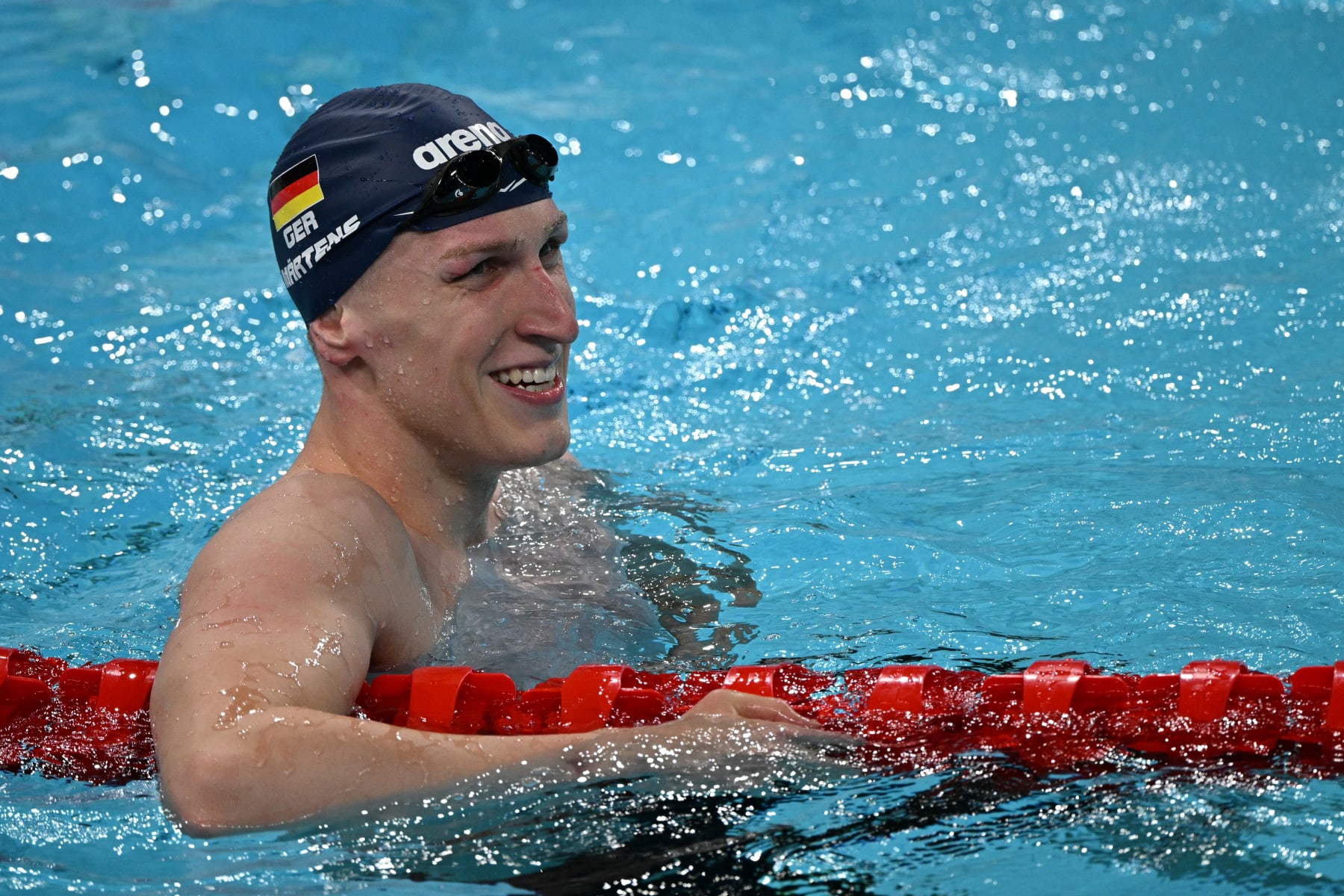 Germany's Lukas Martens reacts after winning the final of the men's 400m freestyle swimming event at the Paris La Defense Arena in Nanterre, west of Paris, on July 27, 2024. (Photo by Oli SCARFF / AFP) (Photo by OLI SCARFF/AFP via Getty Images)