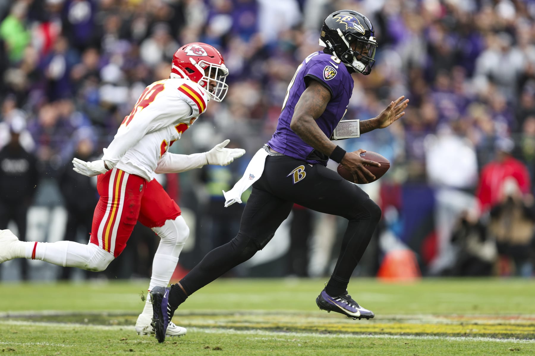BALTIMORE, MD - JANUARY 28: Lamar Jackson #8 of the Baltimore Ravens runs the ball during the AFC Championship NFL football game against the Kansas City Chiefs at M&T Bank Stadium on January 28, 2024 in Baltimore, Maryland. (Photo by Perry Knotts/Getty Images)