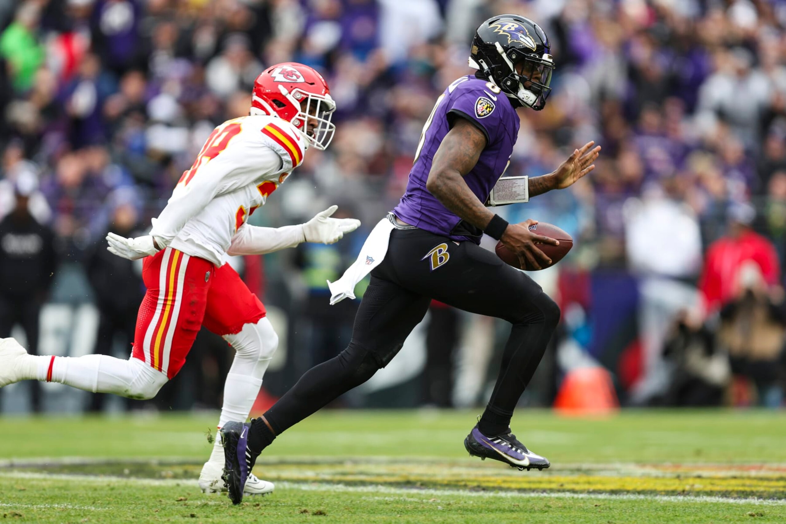 BALTIMORE, MD - JANUARY 28: Lamar Jackson #8 of the Baltimore Ravens runs the ball during the AFC Championship NFL football game against the Kansas City Chiefs at M&T Bank Stadium on January 28, 2024 in Baltimore, Maryland. (Photo by Perry Knotts/Getty Images)