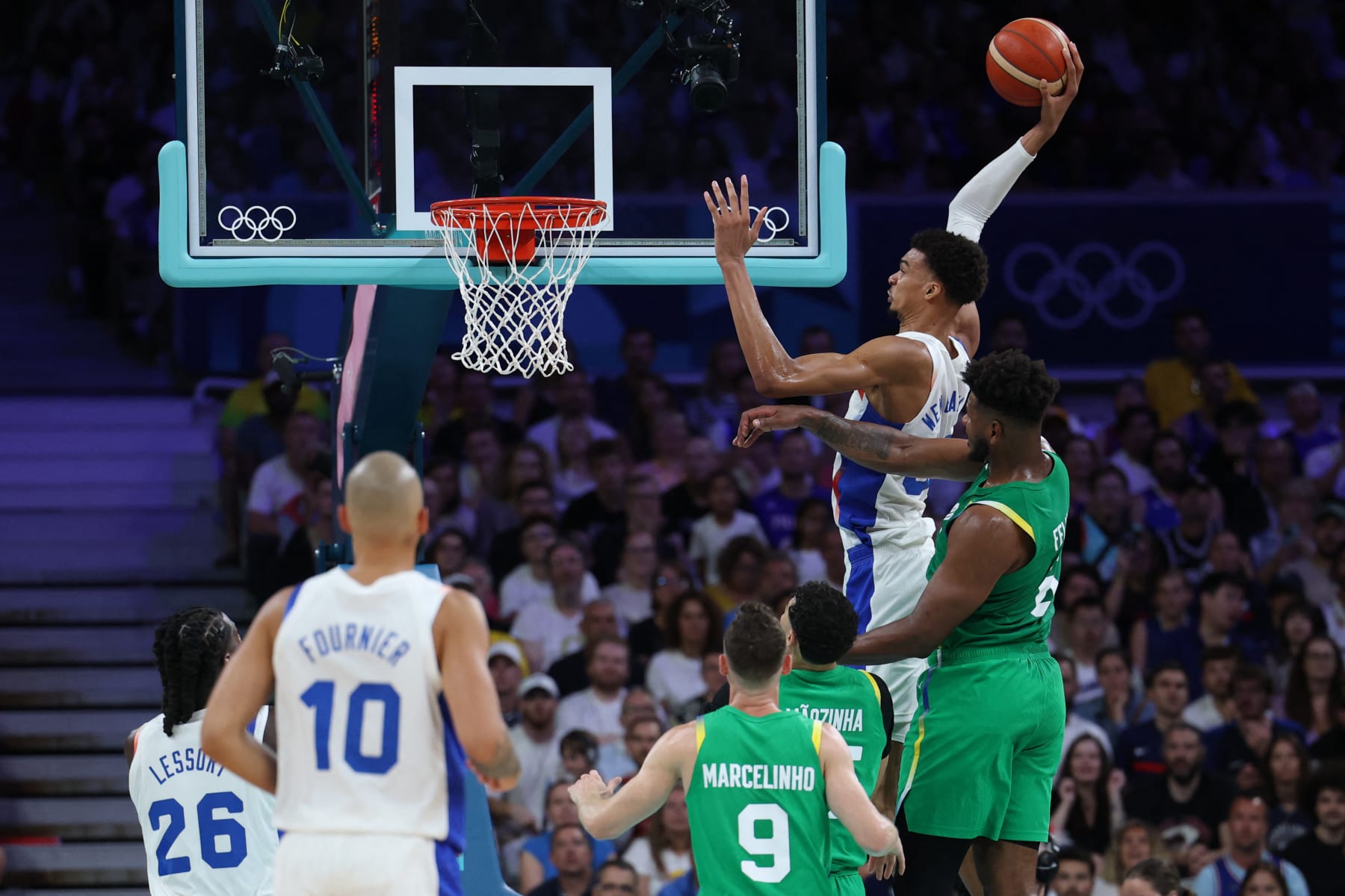 TOPSHOT - France's #32 Victor Wembanyama goes to the basket in the men's preliminary round group B basketball match between France and Brazil during the Paris 2024 Olympic Games at the Pierre-Mauroy stadium in Villeneuve-d'Ascq, northern France, on July 27, 2024. (Photo by Thomas COEX / AFP) (Photo by THOMAS COEX/AFP via Getty Images)