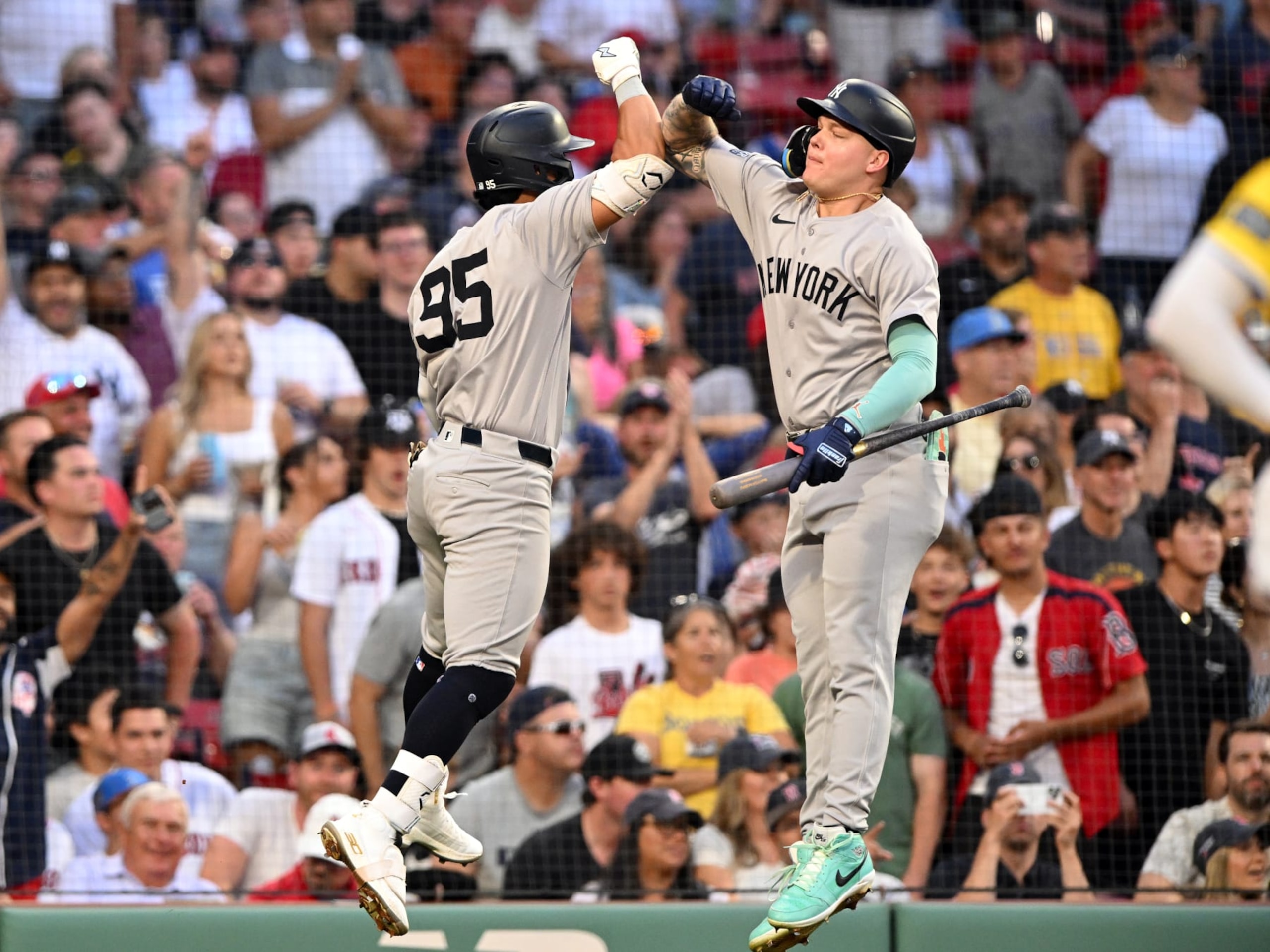 BOSTON, MASSACHUSETTS - JULY 27: Oswaldo Cabrera #95 of the New York Yankees celebrates with Alex Verdugo #24 after hitting a solo home run against the Boston Red Sox during the second inning at Fenway Park on July 27, 2024 in Boston, Massachusetts. (Photo by Brian Fluharty/Getty Images)