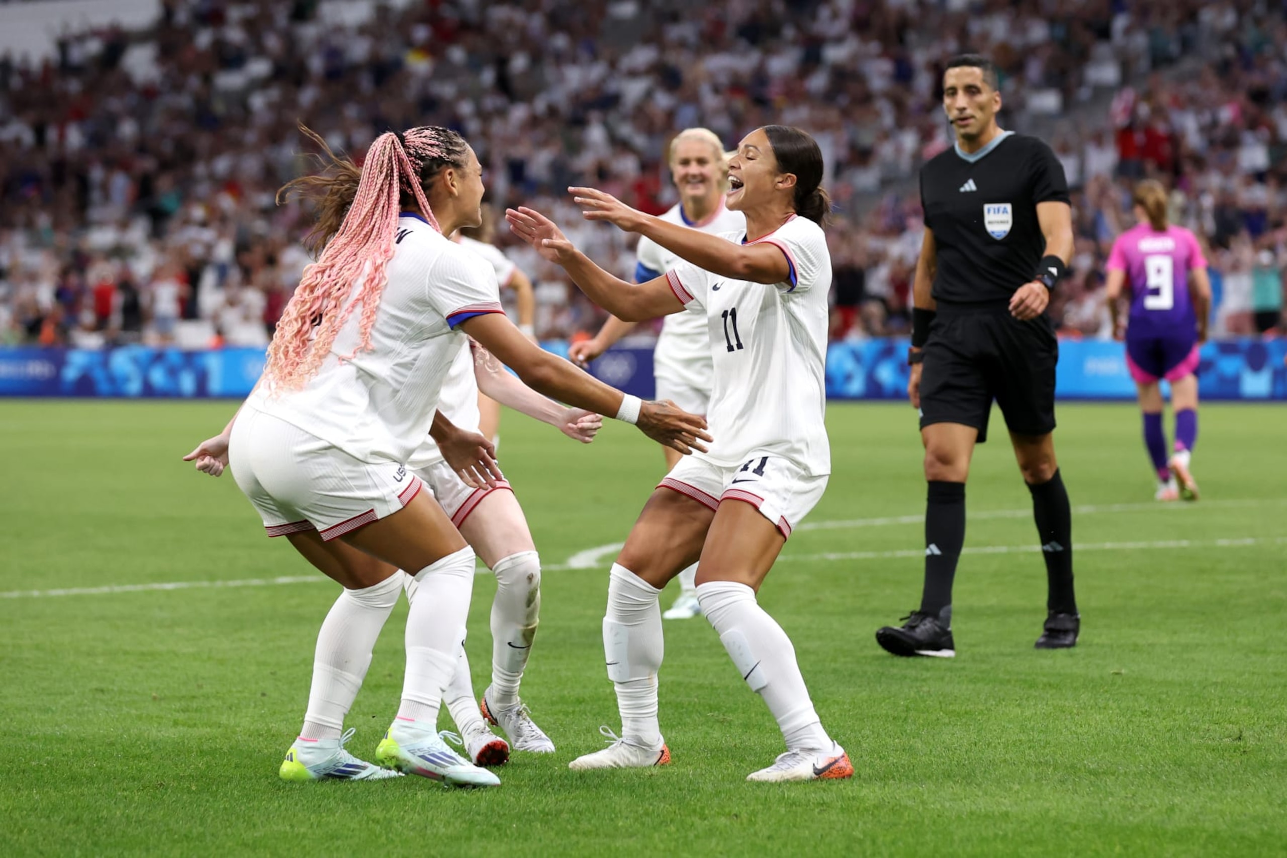 MARSEILLE, FRANCE - JULY 28: Sophia Smith #11 of Team United States celebrates scoring her team's first goal during the Women's group B match between United States and Germany during the Olympic Games Paris 2024 at Stade de Marseille on July 28, 2024 in Marseille, France. (Photo by Alex Livesey/Getty Images) MARSEILLE, FRANCE - JULY 28: Sophia Smith #11 of Team United States celebrates scoring her team's first goal during the Women's group B match between United States and Germany during the Olympic Games Paris 2024 at Stade de Marseille on July 28, 2024 in Marseille, France. (Photo by Alex Livesey/Getty Images)