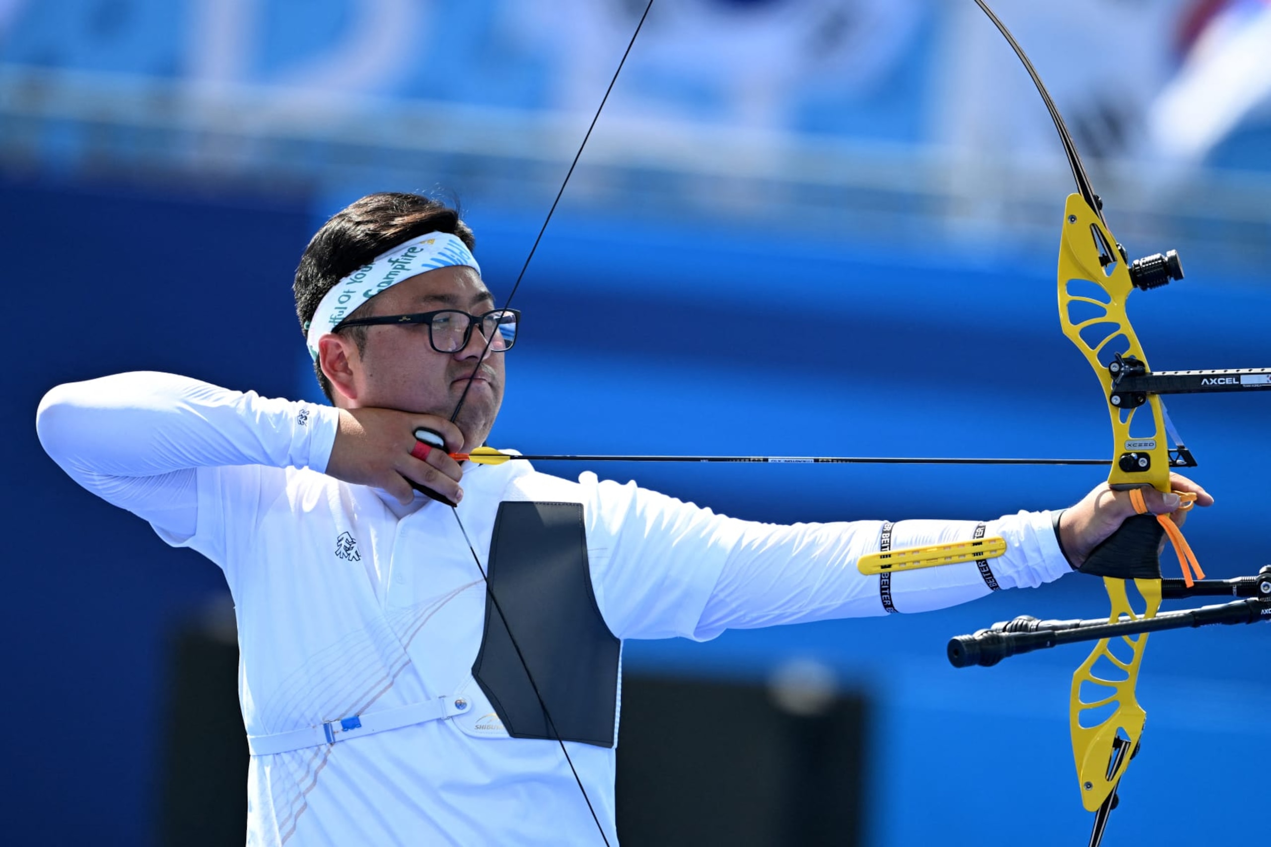 South Korea's Kim Woo-jin competes in the archery men's team semifinal during the Paris 2024 Olympic Games at the Esplanade des Invalides in Paris on July 29, 2024. (Photo by Punit PARANJPE / AFP) (Photo by PUNIT PARANJPE/AFP via Getty Images)