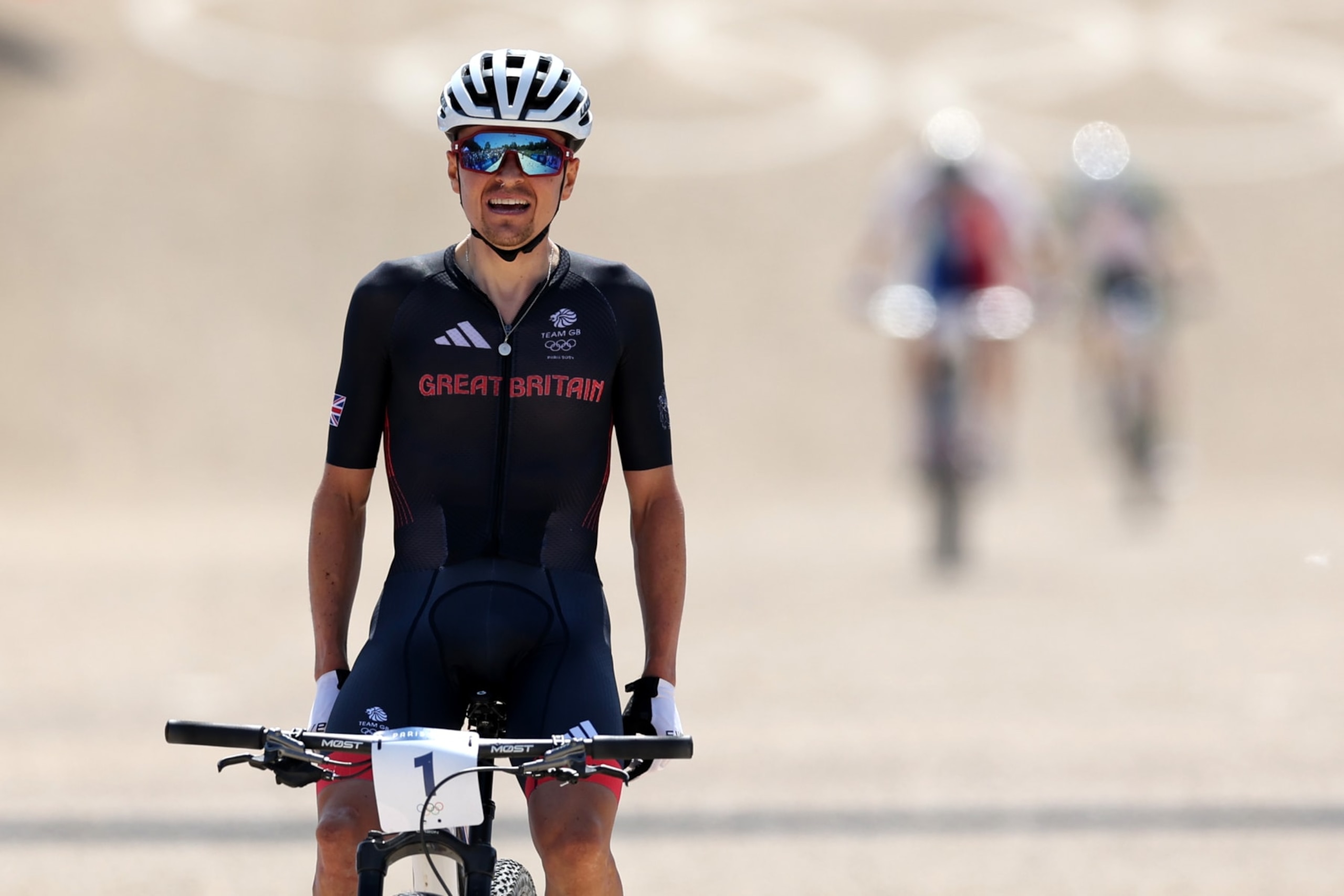 ELANCOURT, FRANCE - JULY 29: Thomas Pidcock of Team Great Britain celebrates at finish line as gold medal winner during the Men's Cross-Country on day three of the Olympic Games Paris 2024 at Elancourt Hill on July 29, 2024 in Elancourt, France. (Photo by Tim de Waele/Getty Images)