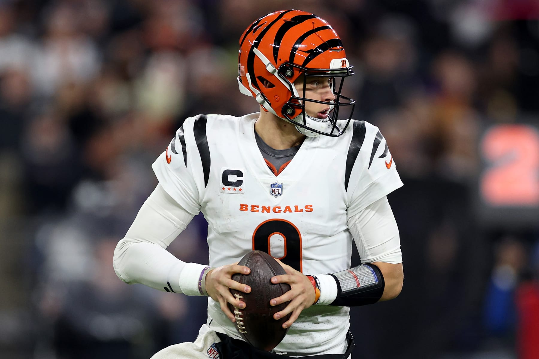 BALTIMORE, MARYLAND - NOVEMBER 16: Joe Burrow #9 of the Cincinnati Bengals scrambles against the Baltimore Ravens during the second quarter of the game at M&T Bank Stadium on November 16, 2023 in Baltimore, Maryland. (Photo by Patrick Smith/Getty Images)