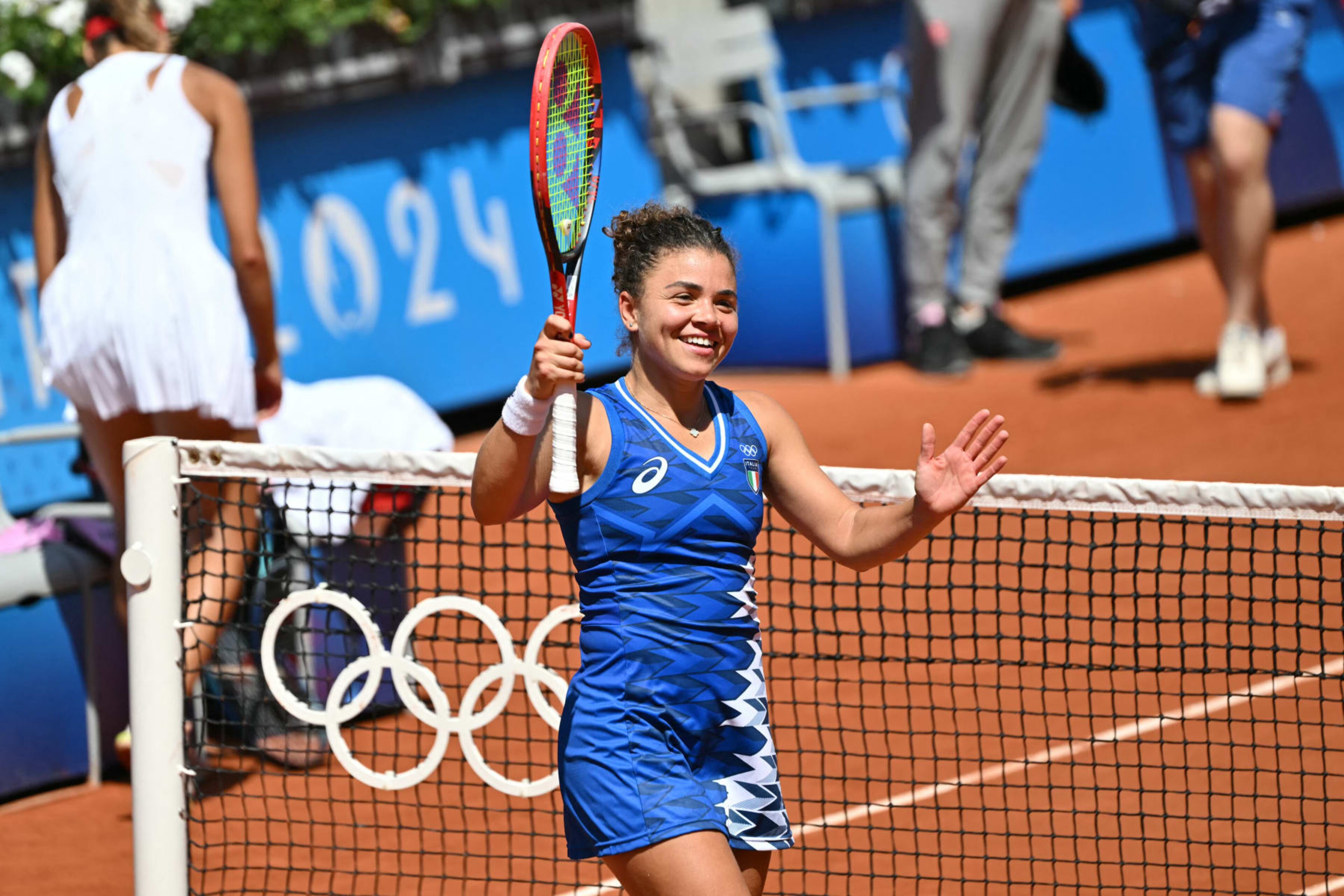Italy's Jasmine Paolini celebrates after beating Poland's Magda Linette during their women's singles second round tennis match on Court Suzanne-Lenglen at the Roland-Garros Stadium at the Paris 2024 Olympic Games, in Paris on July 29, 2024. (Photo by Miguel MEDINA / AFP) (Photo by MIGUEL MEDINA/AFP via Getty Images) Italy's Jasmine Paolini celebrates after beating Poland's Magda Linette during their women's singles second round tennis match on Court Suzanne-Lenglen at the Roland-Garros Stadium at the Paris 2024 Olympic Games, in Paris on July 29, 2024. (Photo by Miguel MEDINA / AFP) (Photo by MIGUEL MEDINA/AFP via Getty Images)