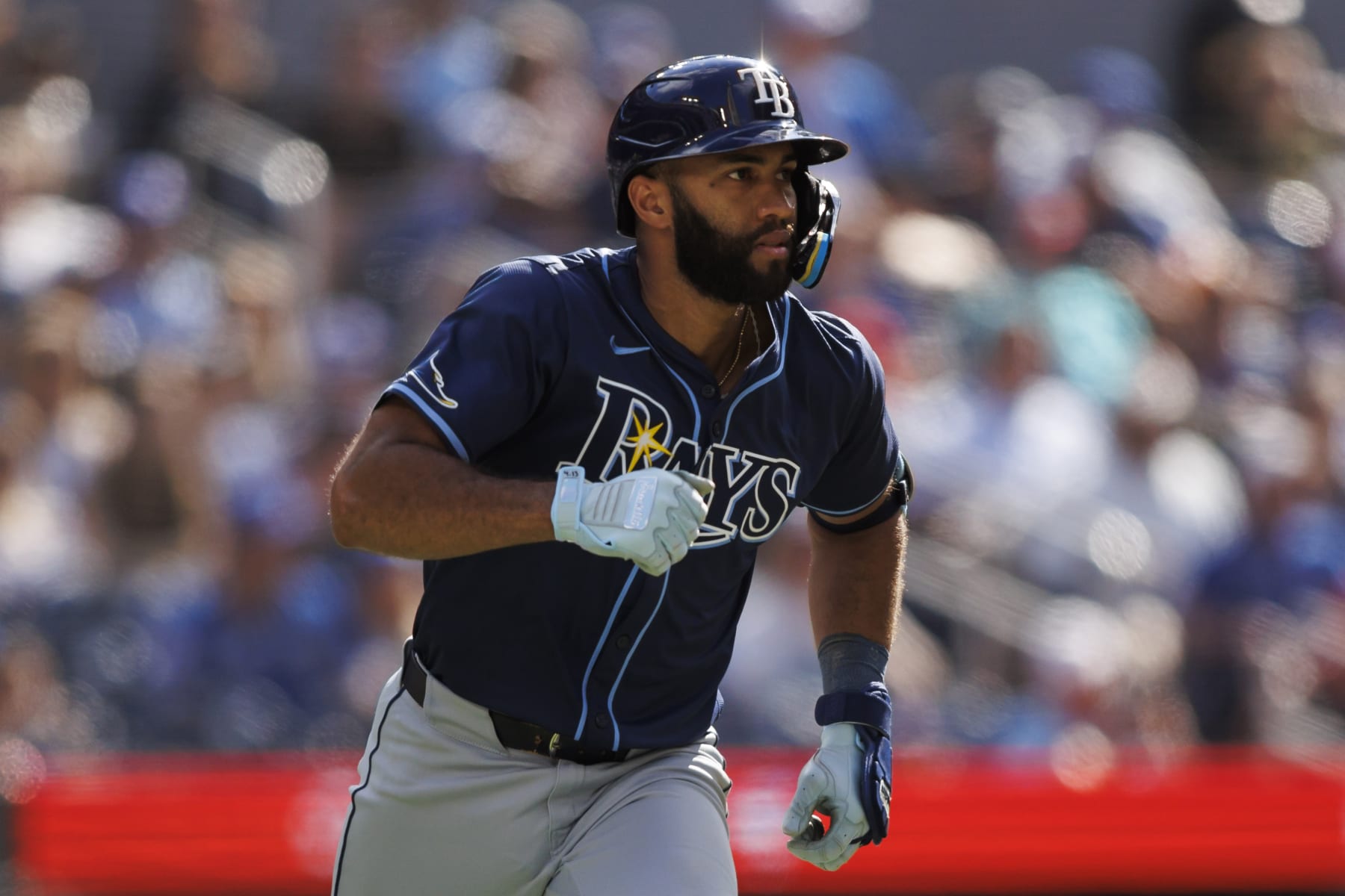 TORONTO, CANADA - JULY 25: Amed Rosario #10 of the Tampa Bay Rays runs out a double in the seventh inning of their MLB game against the Toronto Blue Jays at Rogers Centre on July 25, 2024 in Toronto, Ontario, Canada. (Photo by Cole Burston/Getty Images)