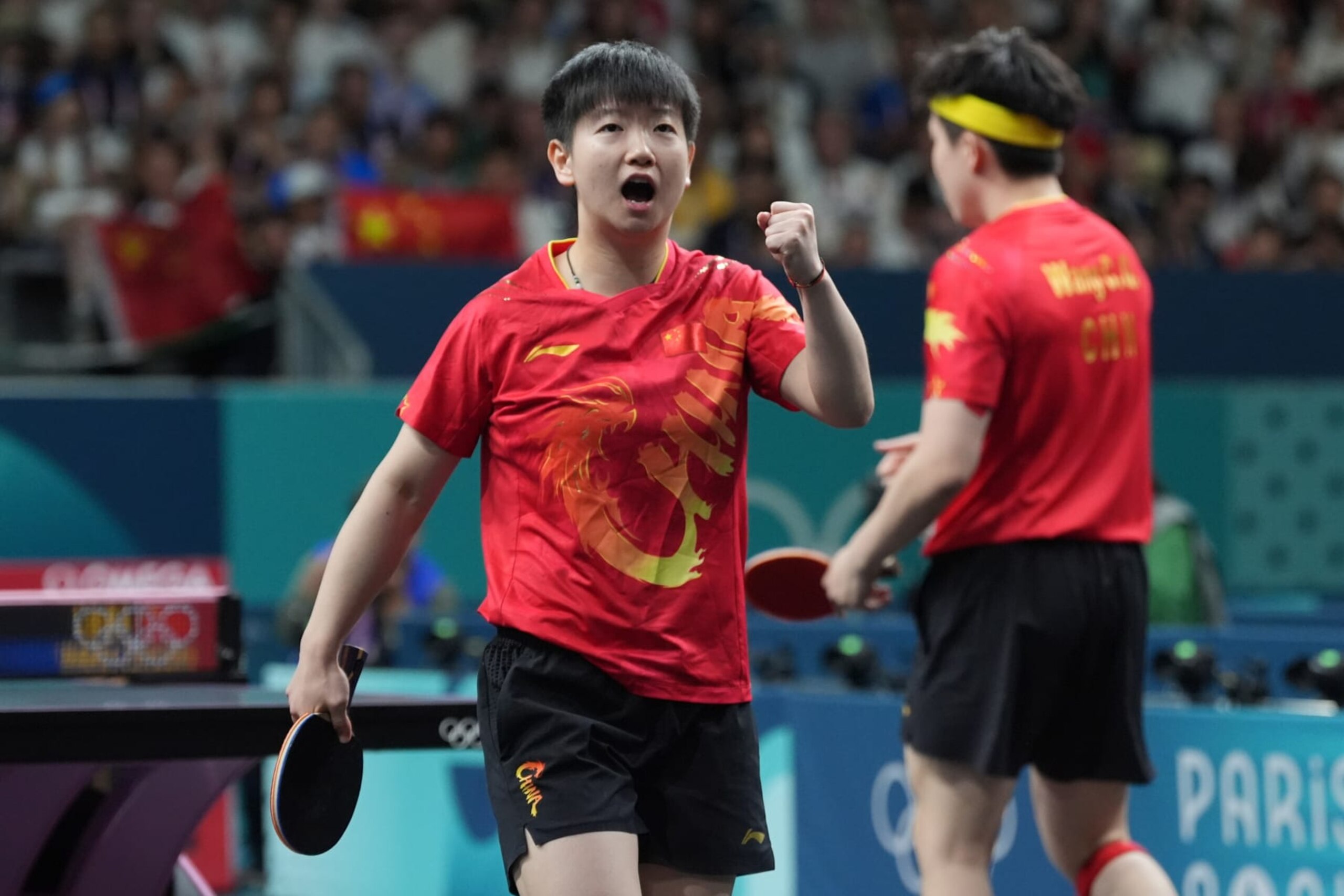 PARIS, FRANCE - JULY 30: Wang Chuqin and Sun Yingsha of Team China react during the Table Tennis - Mixed Doubles Gold Medal match against Ri Jong Sik and Kim Kum Yong of Team North Korea on day four of the Paris 2024 Olympic Games at South Paris Arena on July 30, 2024 in Paris, France. (Photo by Bai Yu/CHINASPORTS/VCG via Getty Images)