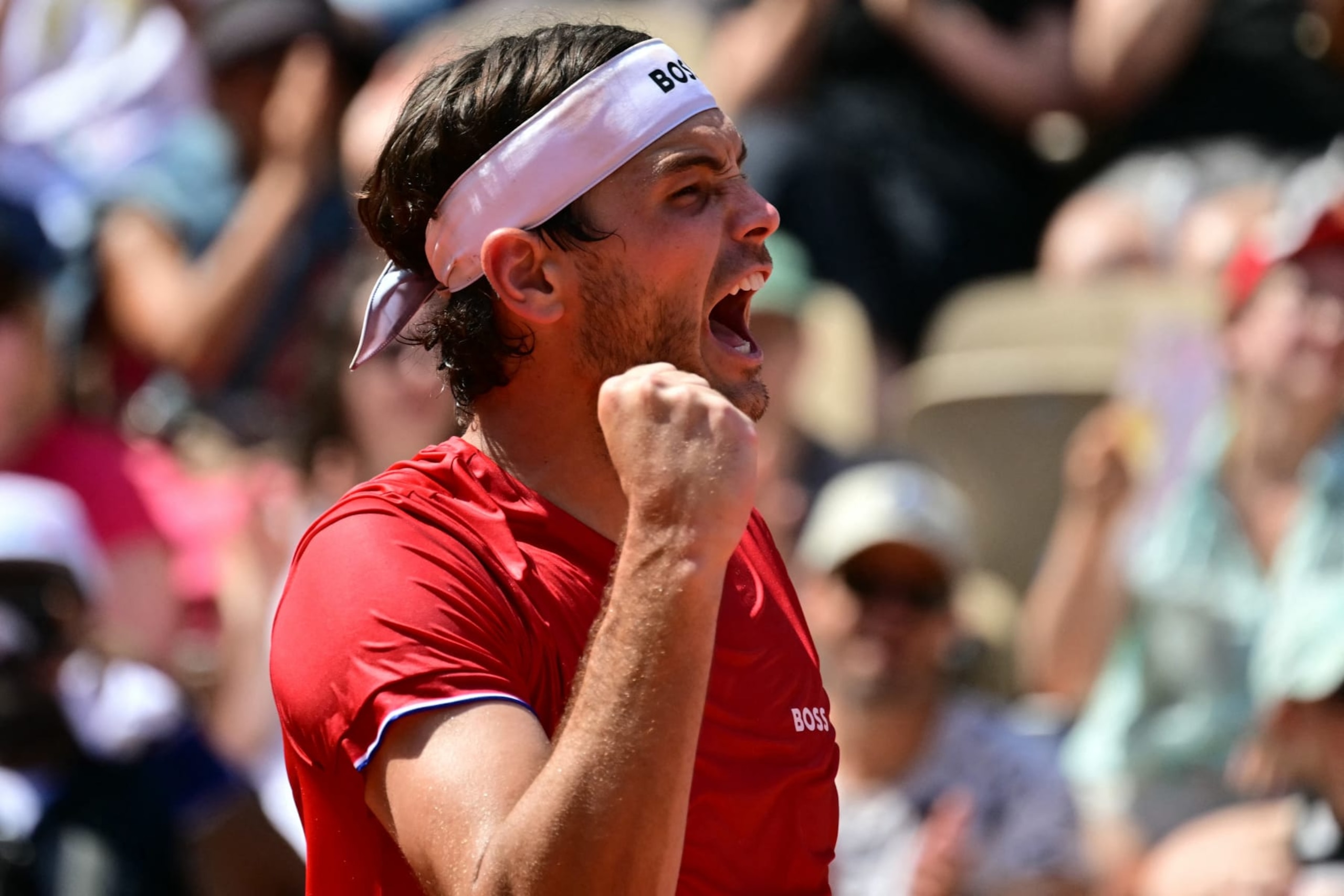 US' Taylor Fritz reacts to beating Britain's Jack Draper in their men's singles second round tennis match on Court Suzanne-Lenglen at the Roland-Garros Stadium during the Paris 2024 Olympic Games, in Paris on July 30, 2024. (Photo by Martin  BERNETTI / AFP) (Photo by MARTIN  BERNETTI/AFP via Getty Images)