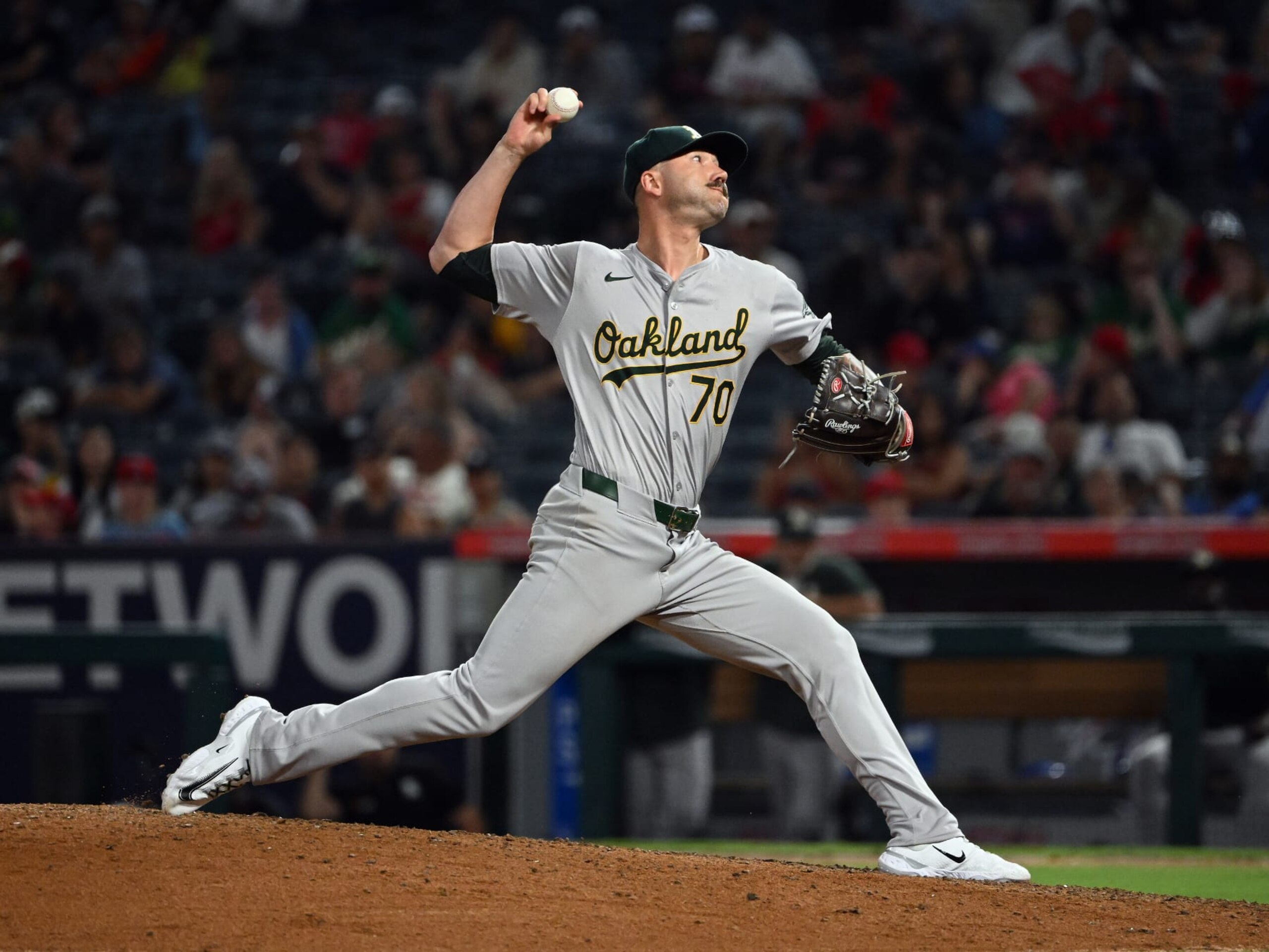 ANAHEIM, CA - JULY 26: Oakland Athletics pitcher Lucas Erceg (70) pitching during an MLB baseball game against the Los Angeles Angels played on July 26, 2024 at Angel Stadium in Anaheim. CA. (Photo by John Cordes/Icon Sportswire via Getty Images)