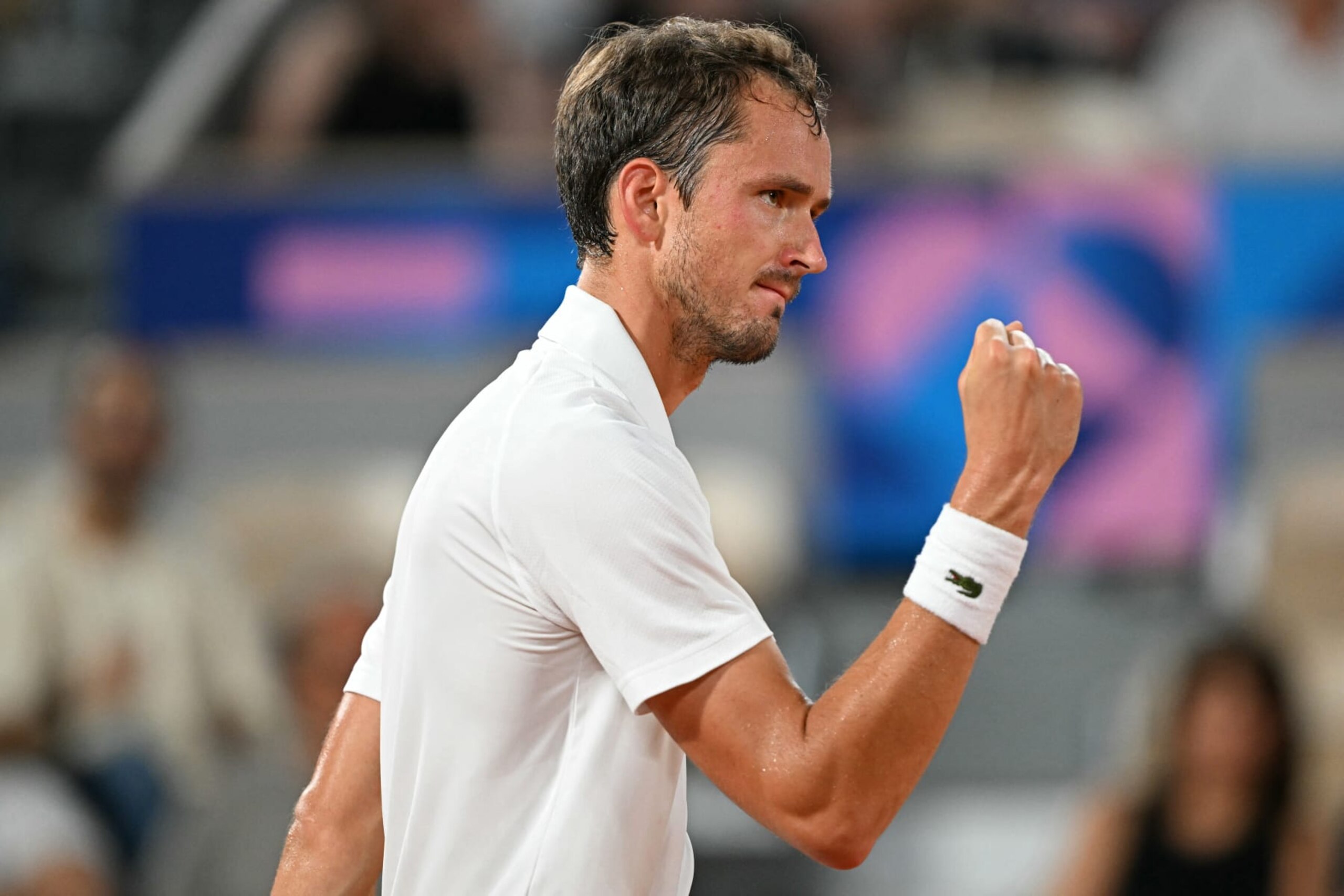 Individual Neutral Athlete Daniil Medvedev reacts while playing Austria's Sebastian Ofner during their men's singles second round tennis match on Court Philippe-Chatrier at the Roland-Garros Stadium during the Paris 2024 Olympic Games, in Paris on July 30, 2024. (Photo by Patricia DE MELO MOREIRA / AFP) (Photo by PATRICIA DE MELO MOREIRA/AFP via Getty Images)