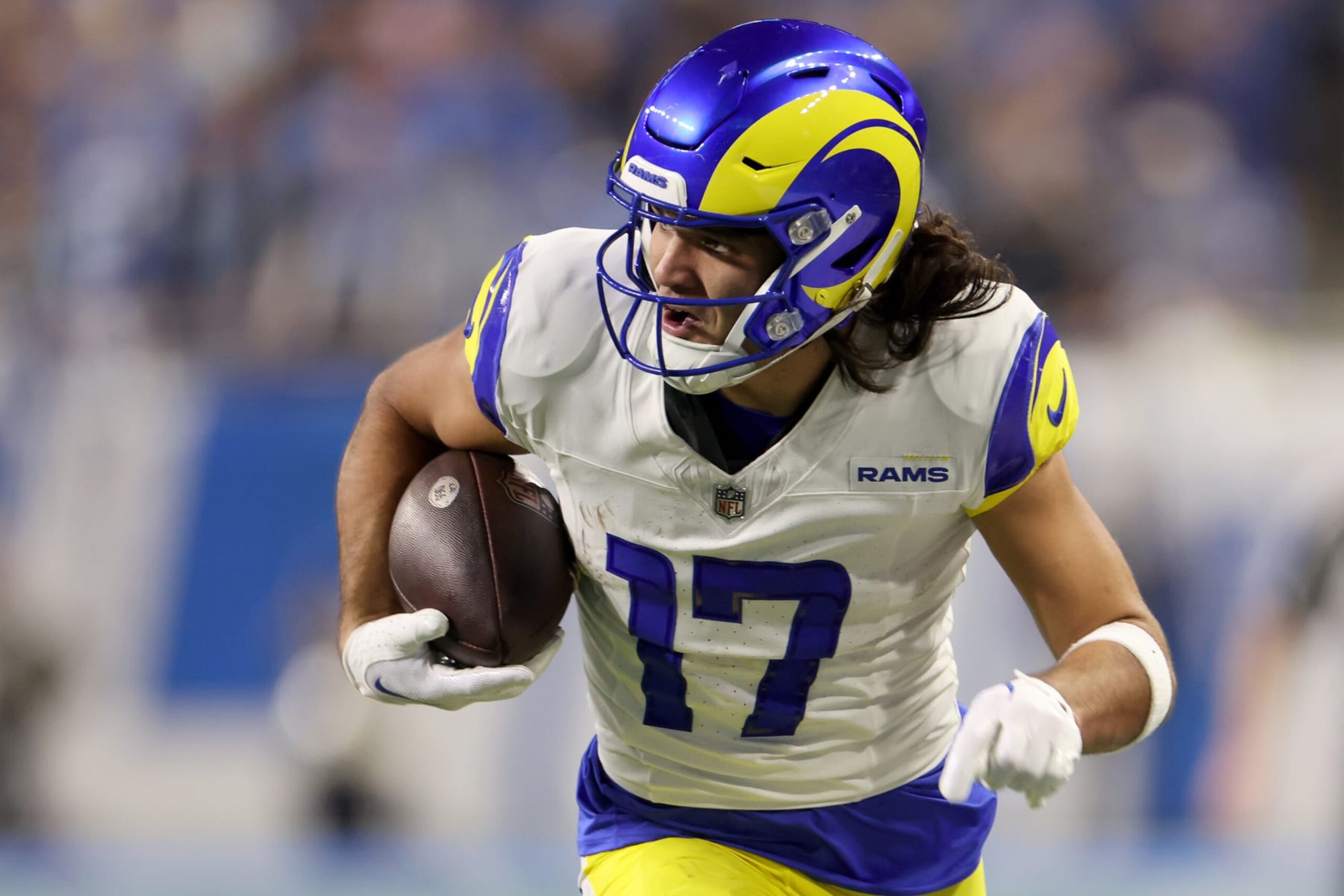 DETROIT, MICHIGAN - JANUARY 14: Puka Nacua #17 of the Los Angeles Rams runs the ball for a touchdown during the second quarter against the Detroit Lions in the NFC Wild Card Playoffs at Ford Field on January 14, 2024 in Detroit, Michigan. (Photo by Gregory Shamus/Getty Images)