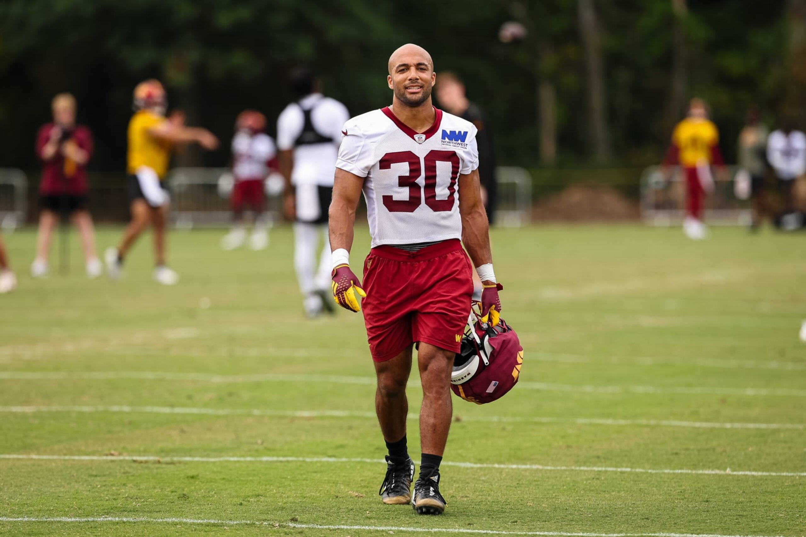 ASHBURN, VA - JULY 25: Austin Ekeler #30 of the Washington Commanders looks on during training camp at OrthoVirginia Training Center at Commanders Park on July 25, 2024 in Ashburn, Virginia. (Photo by Scott Taetsch/Getty Images)