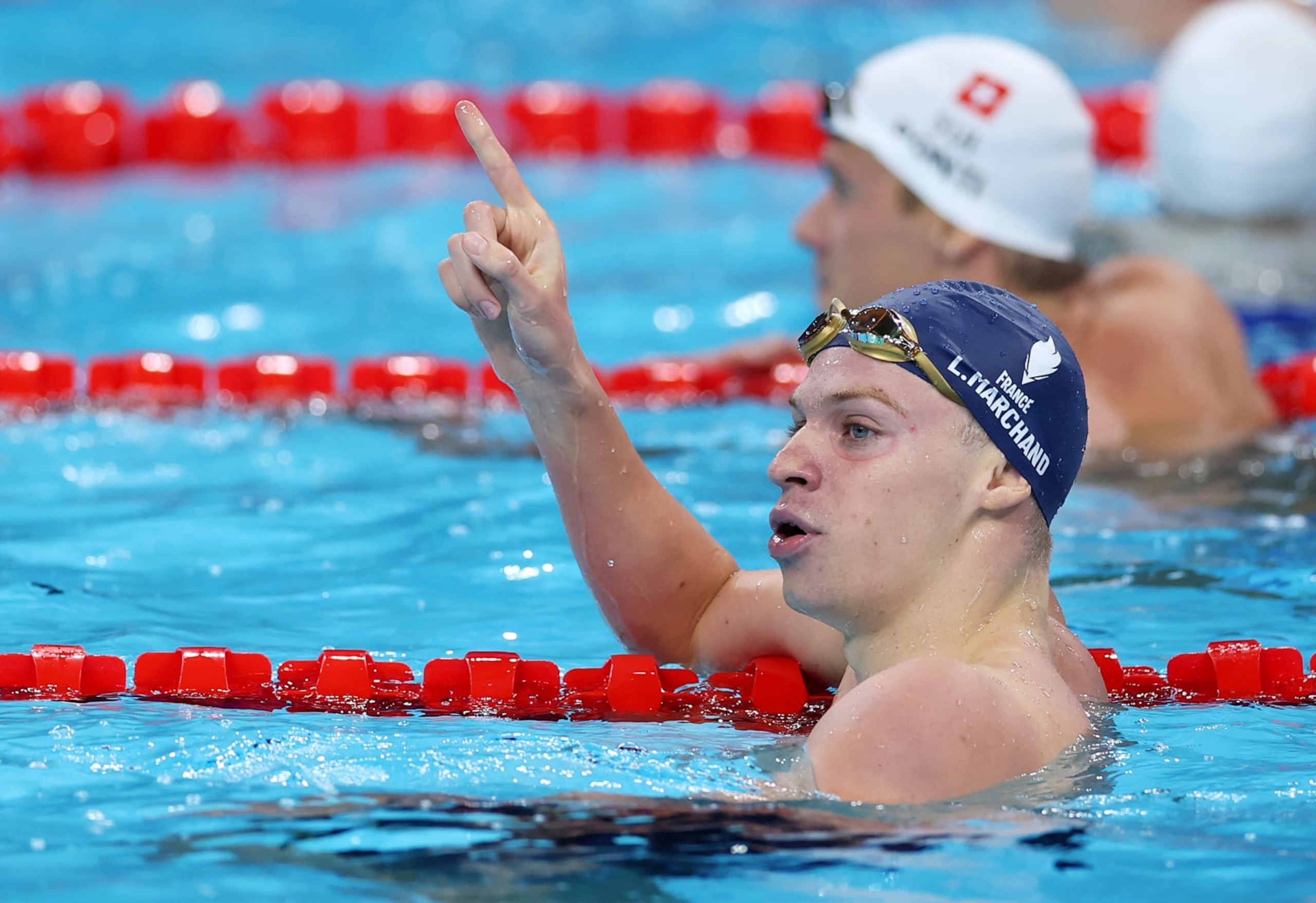 NANTERRE, FRANCE - JULY 31: Leon Marchand of Team France celebrates after winning gold in the Men's 200m Butterfly Final on day five of the Olympic Games Paris 2024 at Paris La Defense Arena on July 31, 2024 in Nanterre, France. (Photo by Maddie Meyer/Getty Images)